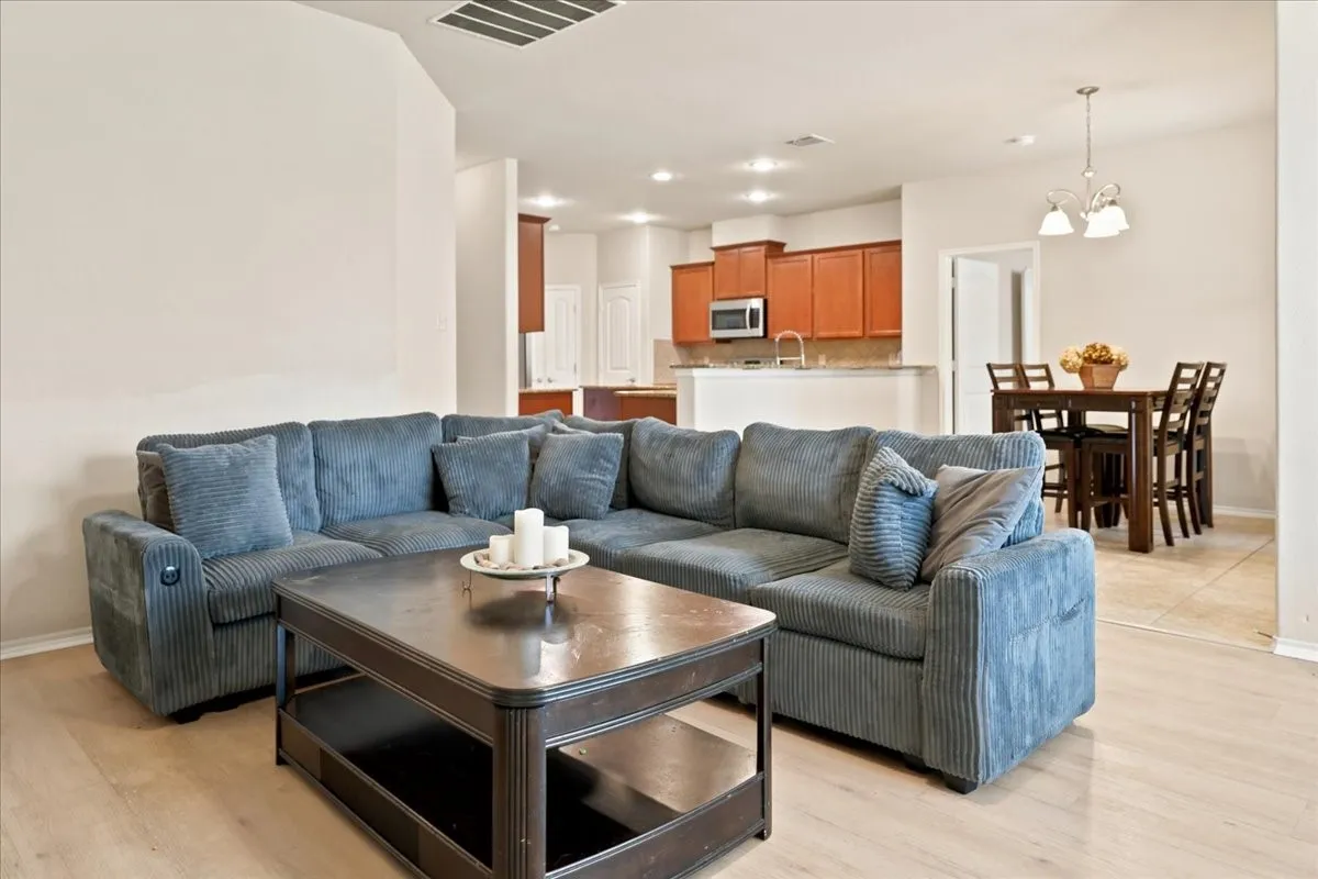 Expansive living room towards breakfast area and kitchen.
