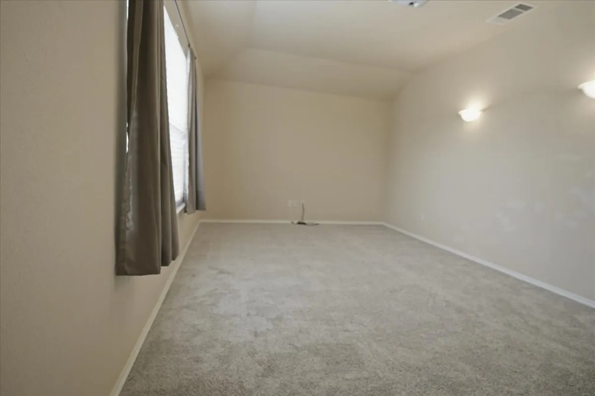 Media room upstairs, could also be used as a large extra bedroom upstairs if you added a wardrobe for a closet.