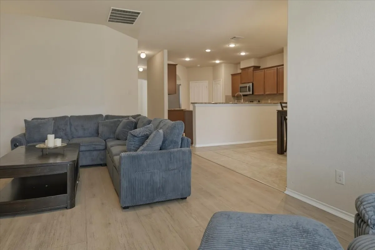 Living room looking into kitchen & breakfast nook