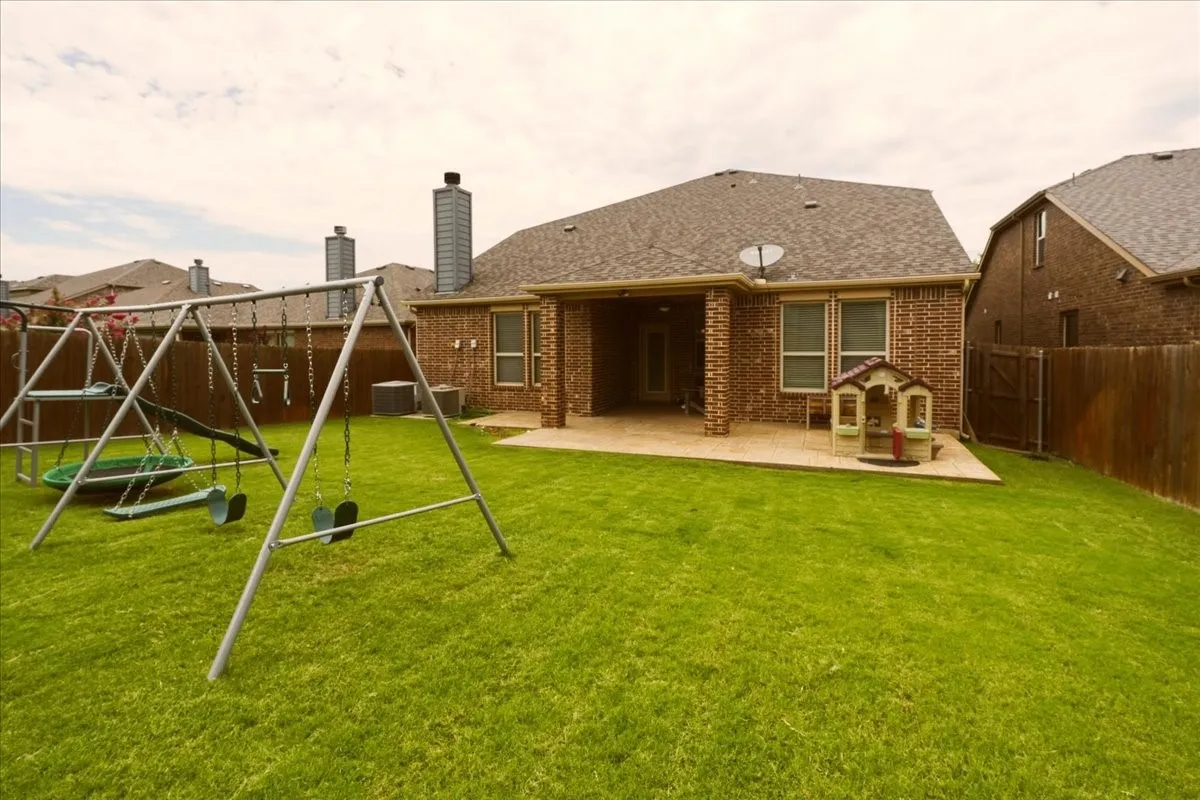 Back of yard towards the back of the house.