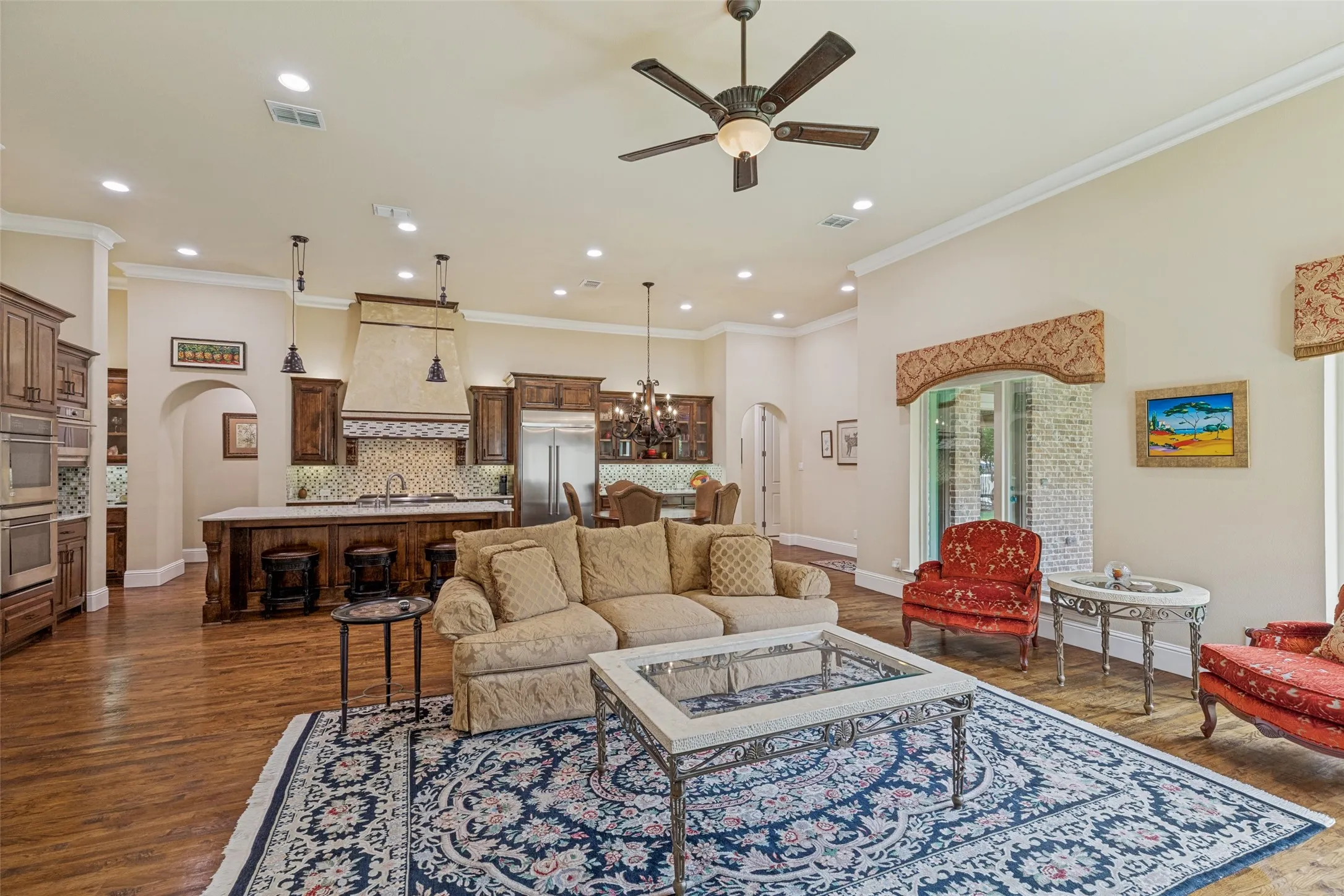 Two additional windows are in the space between the family room and the breakfast area. Shades hidden by decorative valances cover all the windows in the family room.