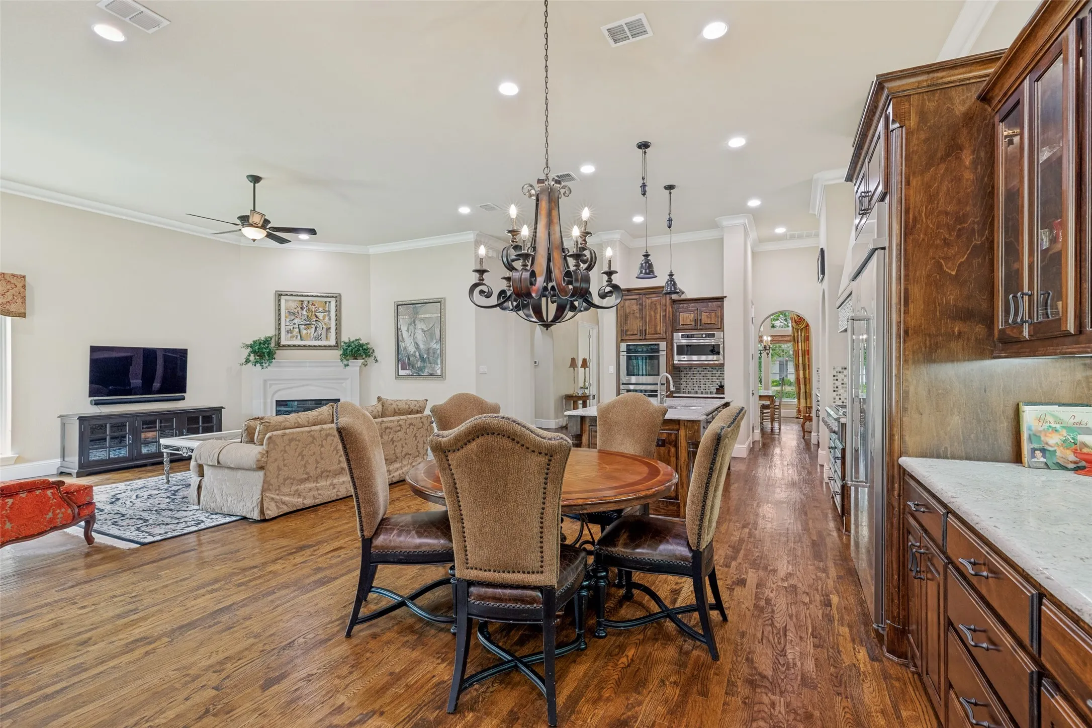 From the front to the back, the custom features in this Darling built home are evident.  Arched entryways that support the style of the outside exterior continue inside and add architectural interest, and the high end finish and features can be seen throughout.
