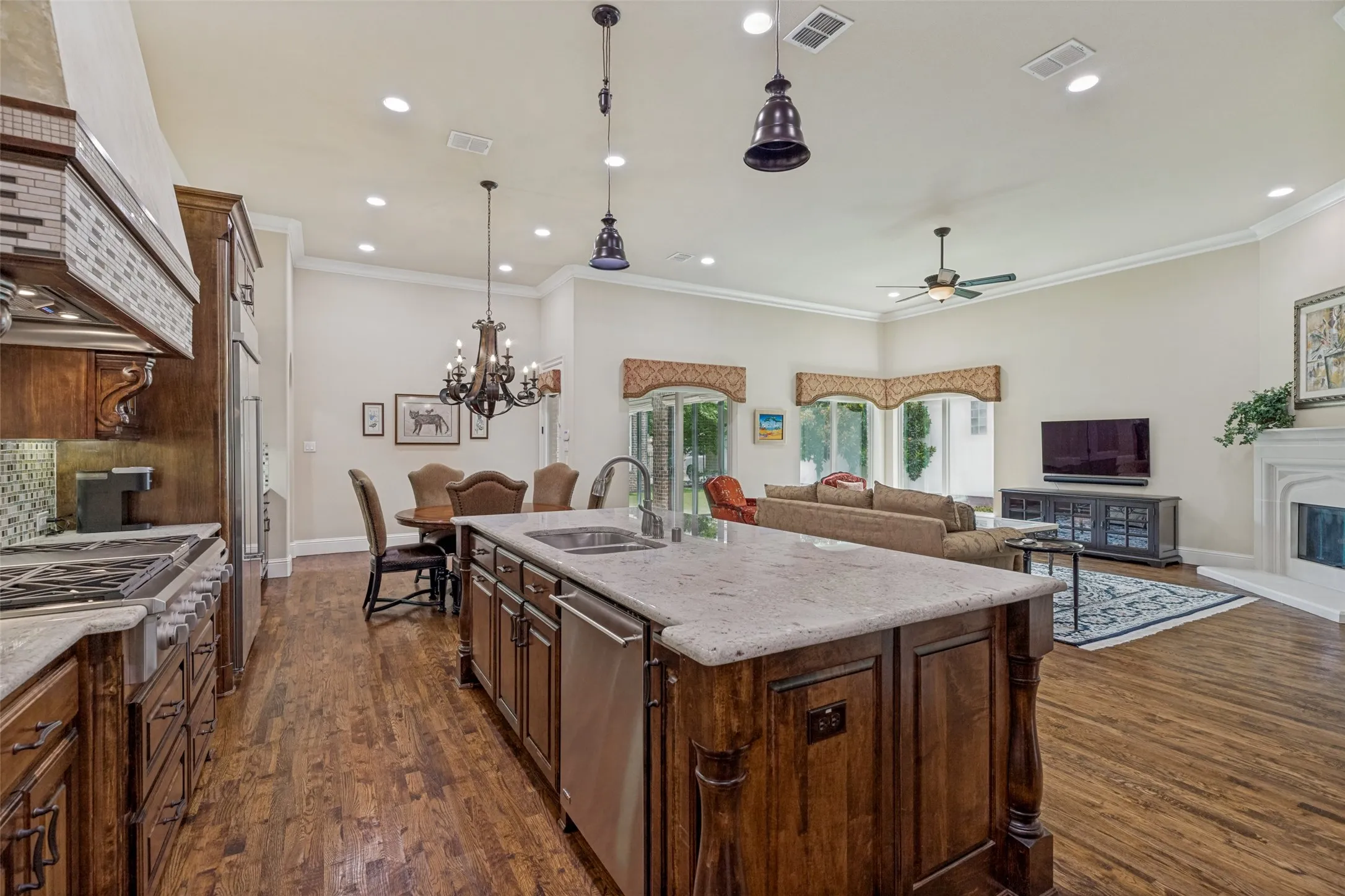 The open concept of the popular floorplan allows family and guests to participate in activities together.  The flexible space also allows abundant choices of furniture styles and placement.