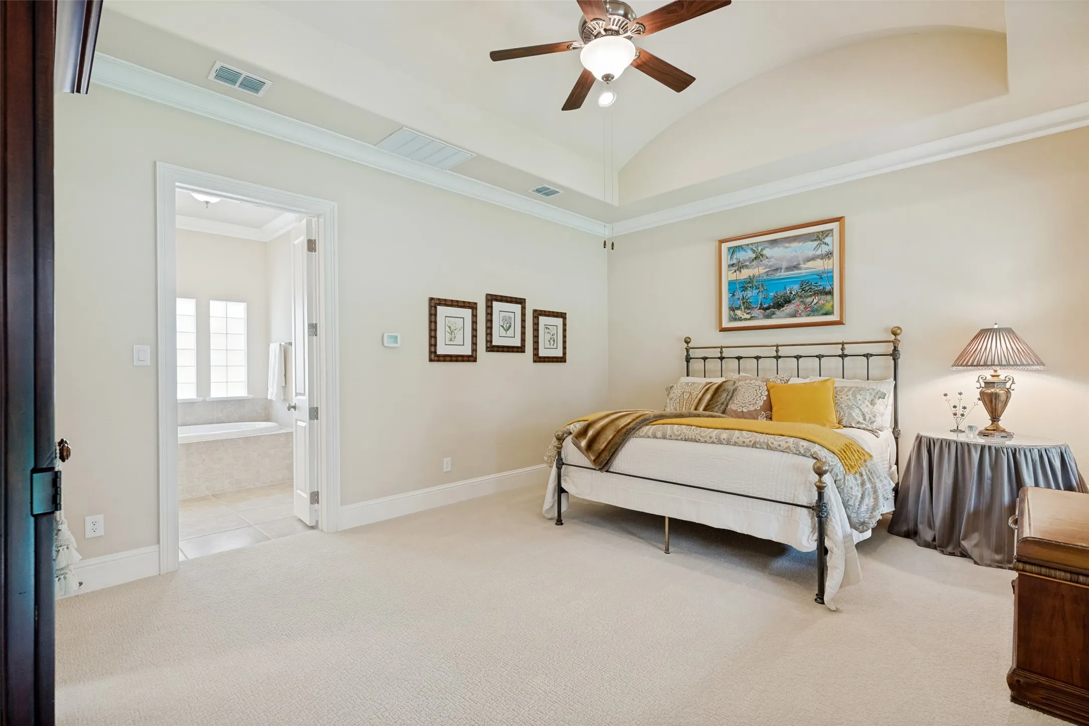 There is plenty of room for furniture in this large bedroom.  The suite incudes a private bath accessed by a pair of doors.  Return air vents in the room keep the temperature comfortable.