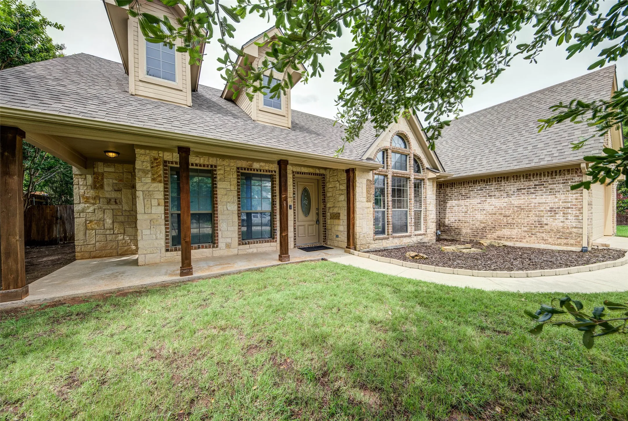 Inviting covered front porch with charming curb appeal