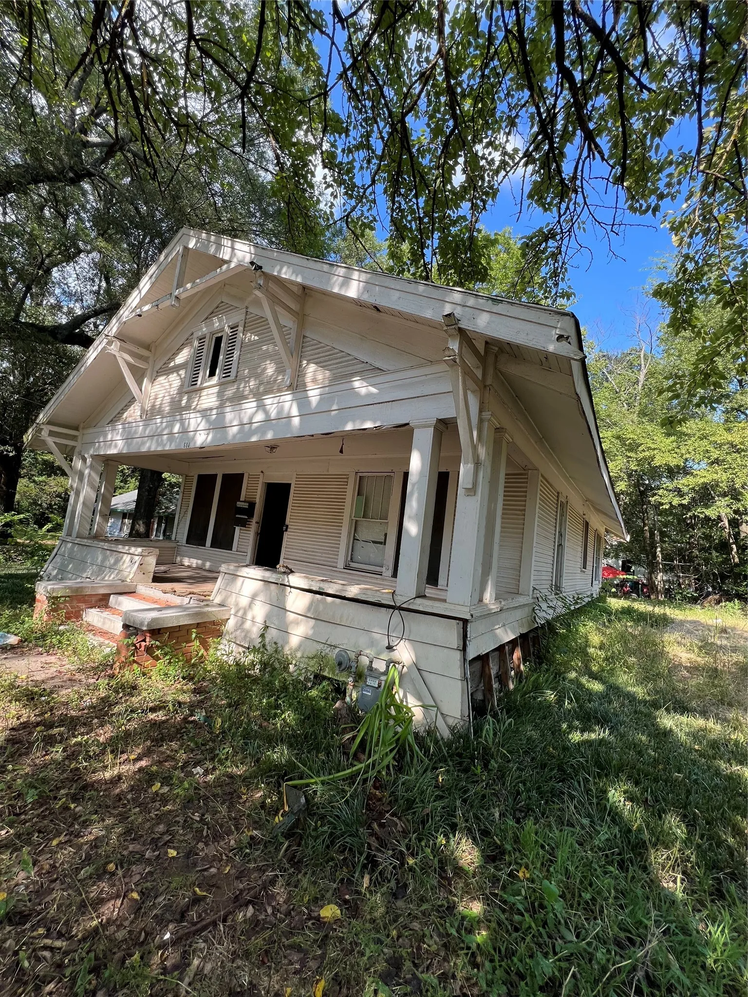 Single-story residence featuring a covered front porch with square columns and a gabled roofline