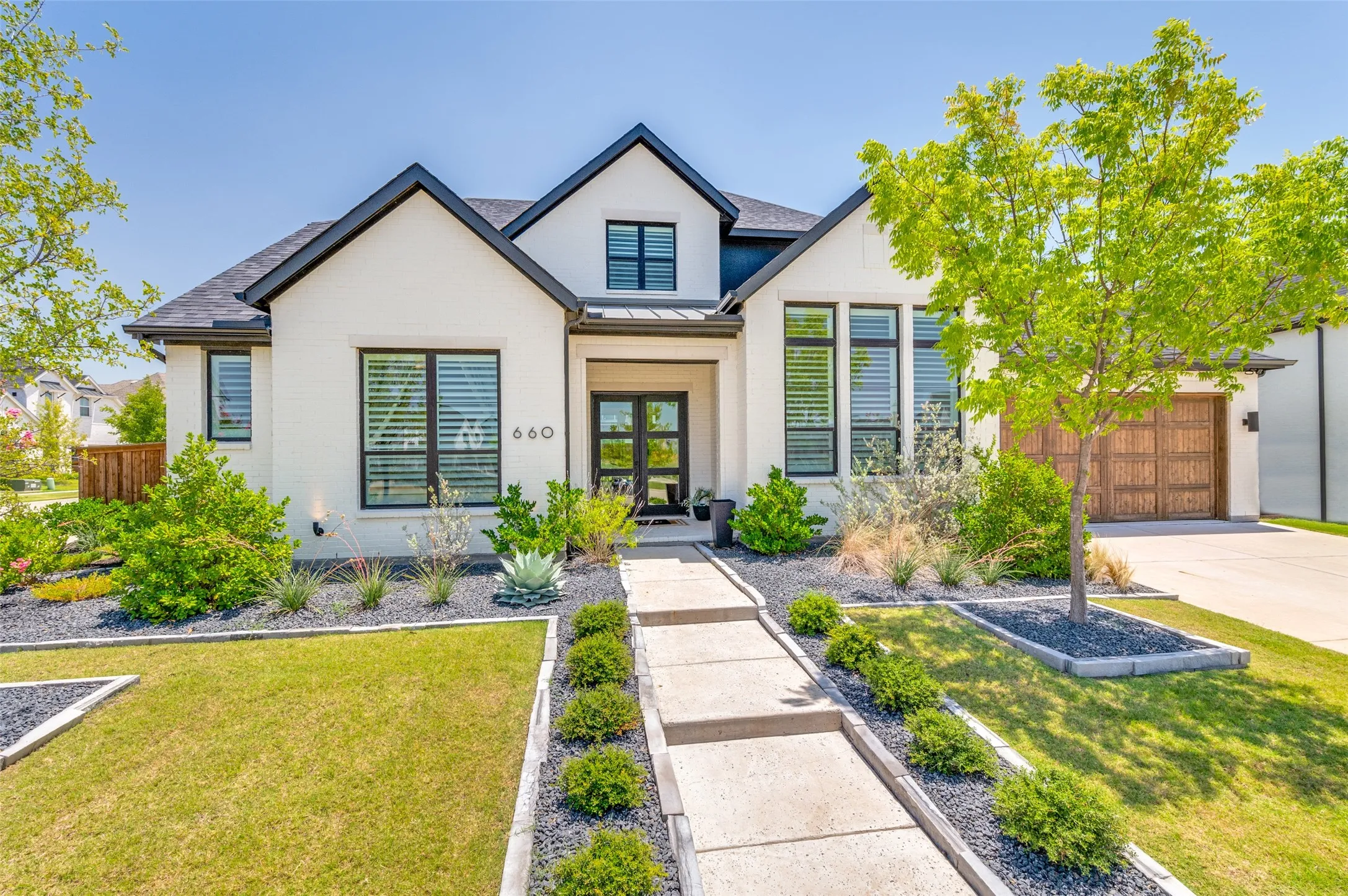 Modern curb appeal, premium architectural details and a welcoming front porch create an unforgettable first impression.

