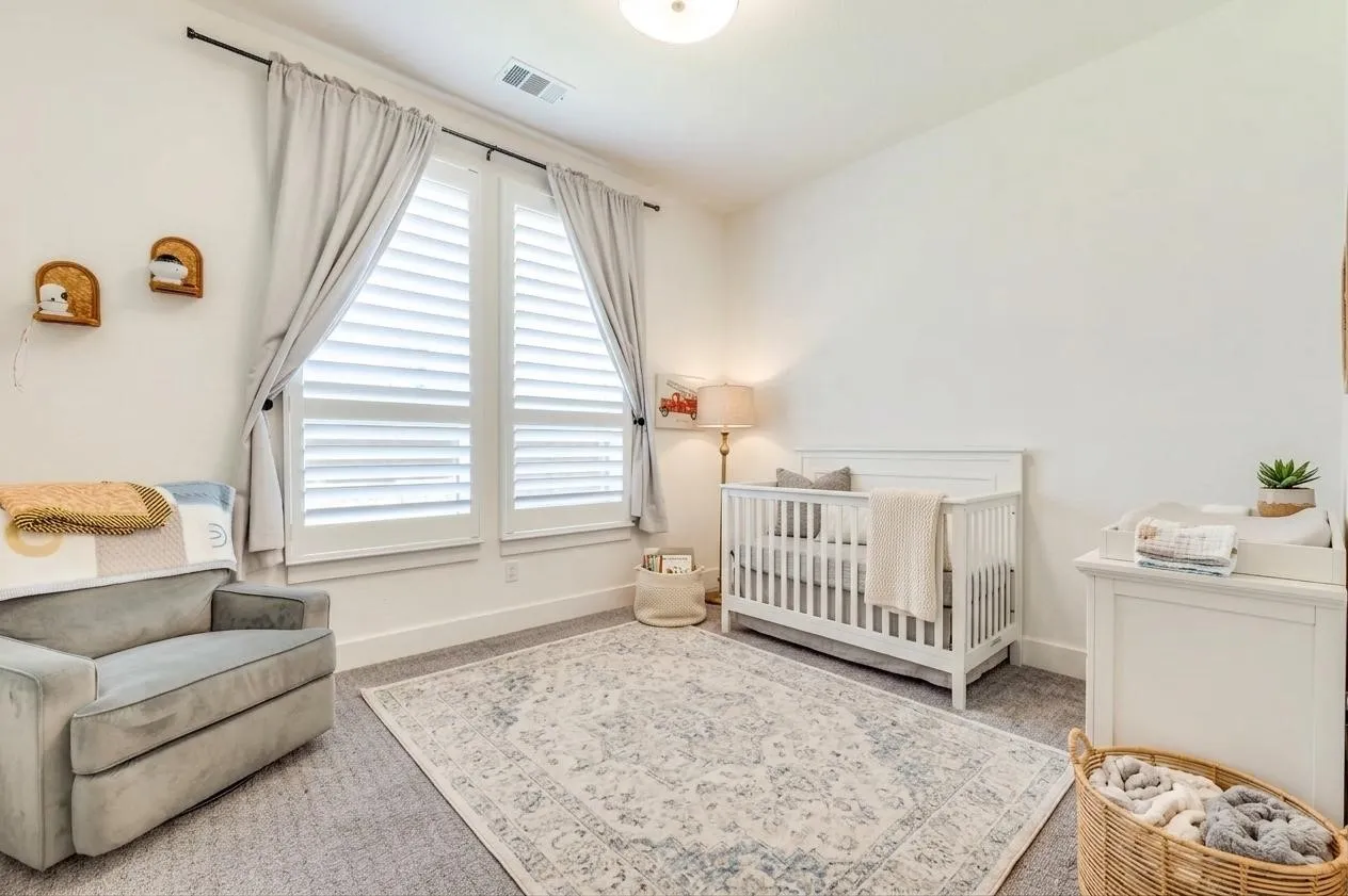 Flexible bedroom ideal for children, guests or a second home office. Some furniture, accents and accessories were Virtually Staged.
