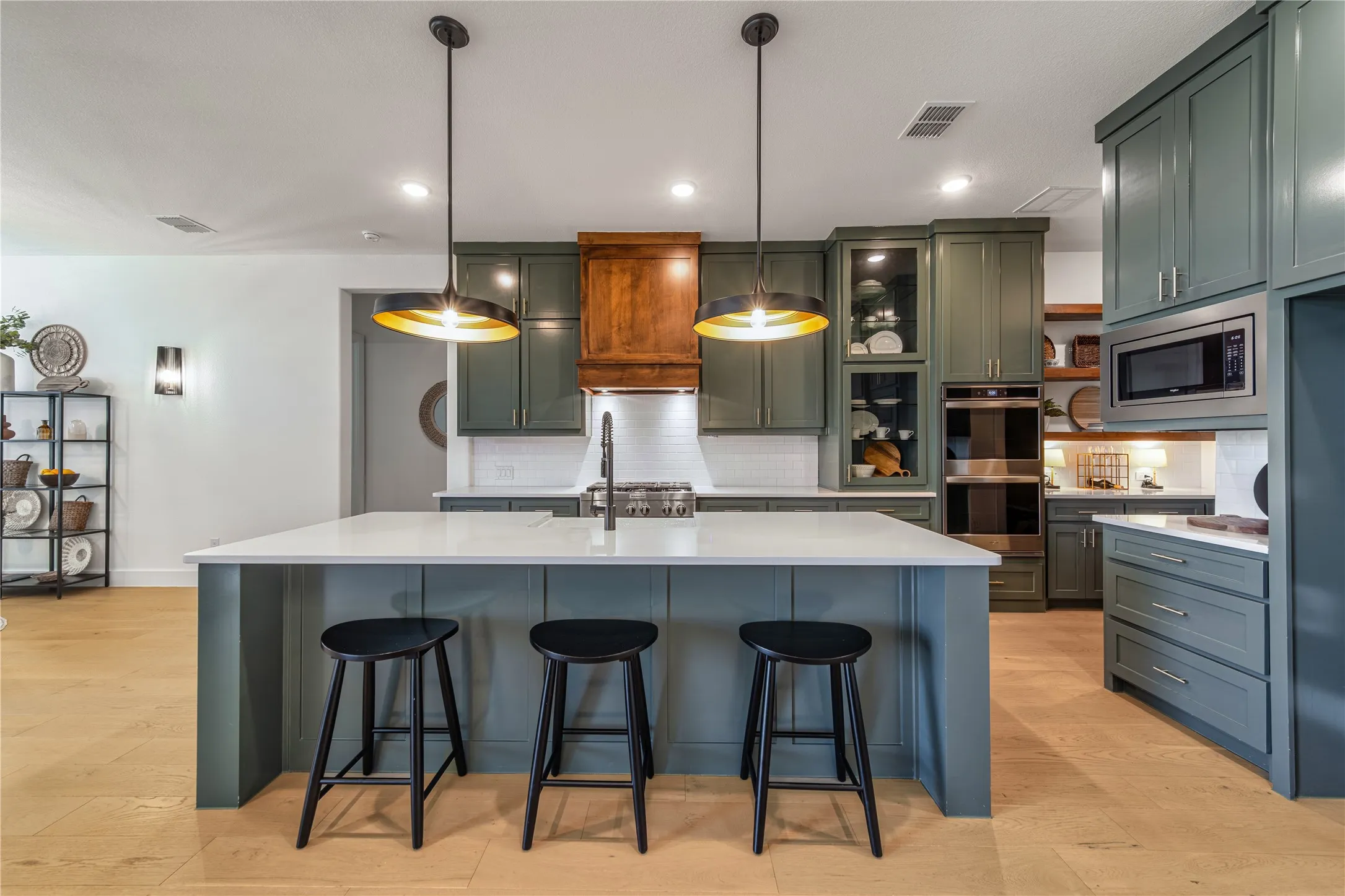 Designed for the home chef with a six-burner KitchenAid gas cooktop, commercial-style vent hood and oversized island for gathering.