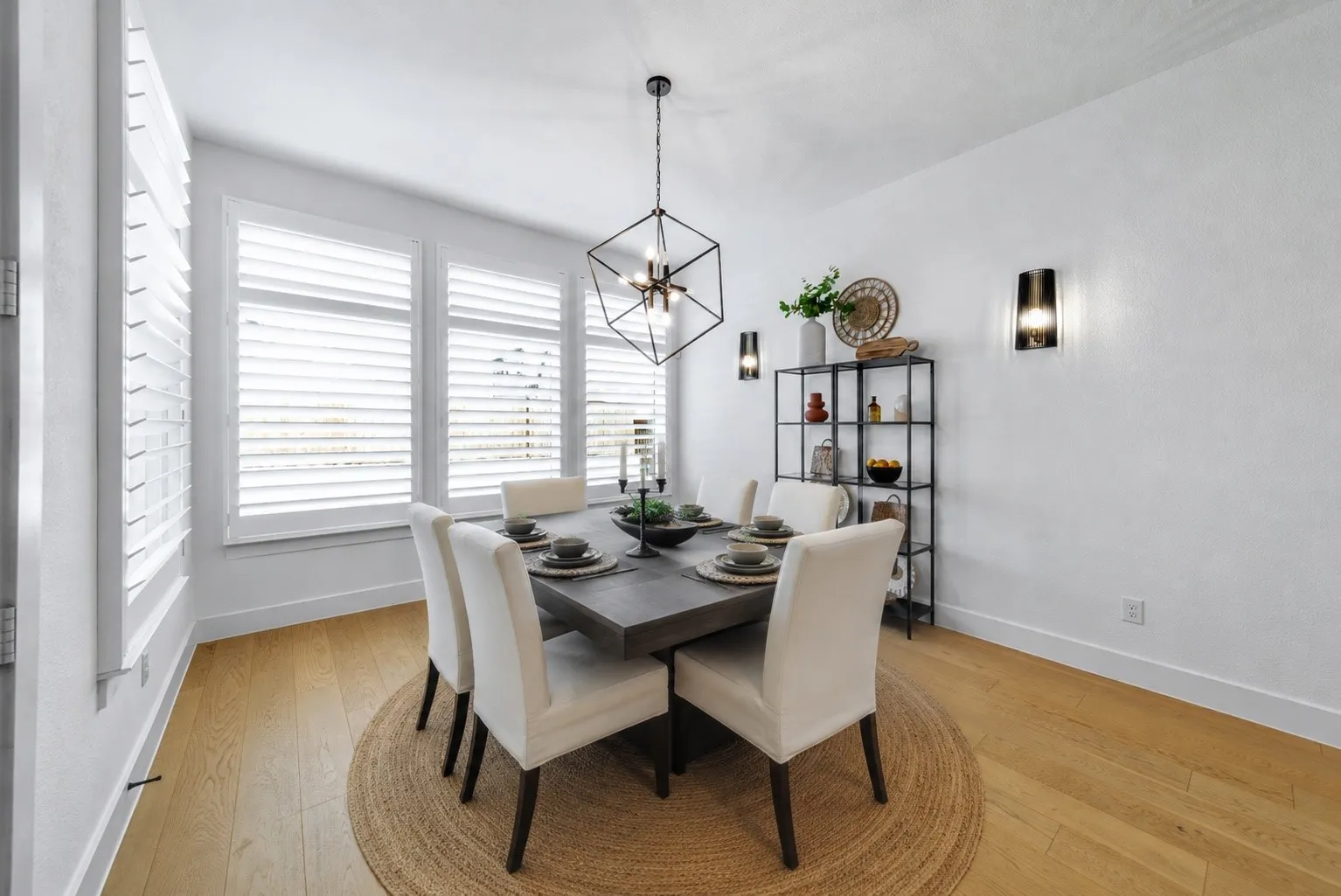 Large picture windows fill the dining space with natural light while maintaining an open connection to the heart of the home. Some accents and furniture were Virtually Staged.