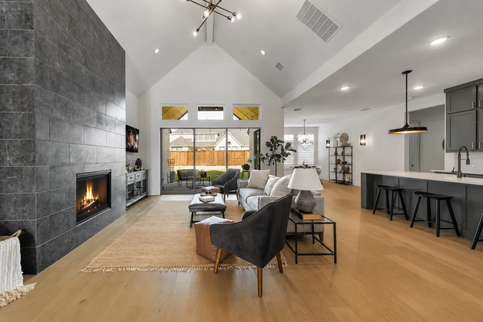 Expansive sliding glass doors blur the line between indoor and outdoor living, making entertaining effortless. Some accents were Virtually Staged.