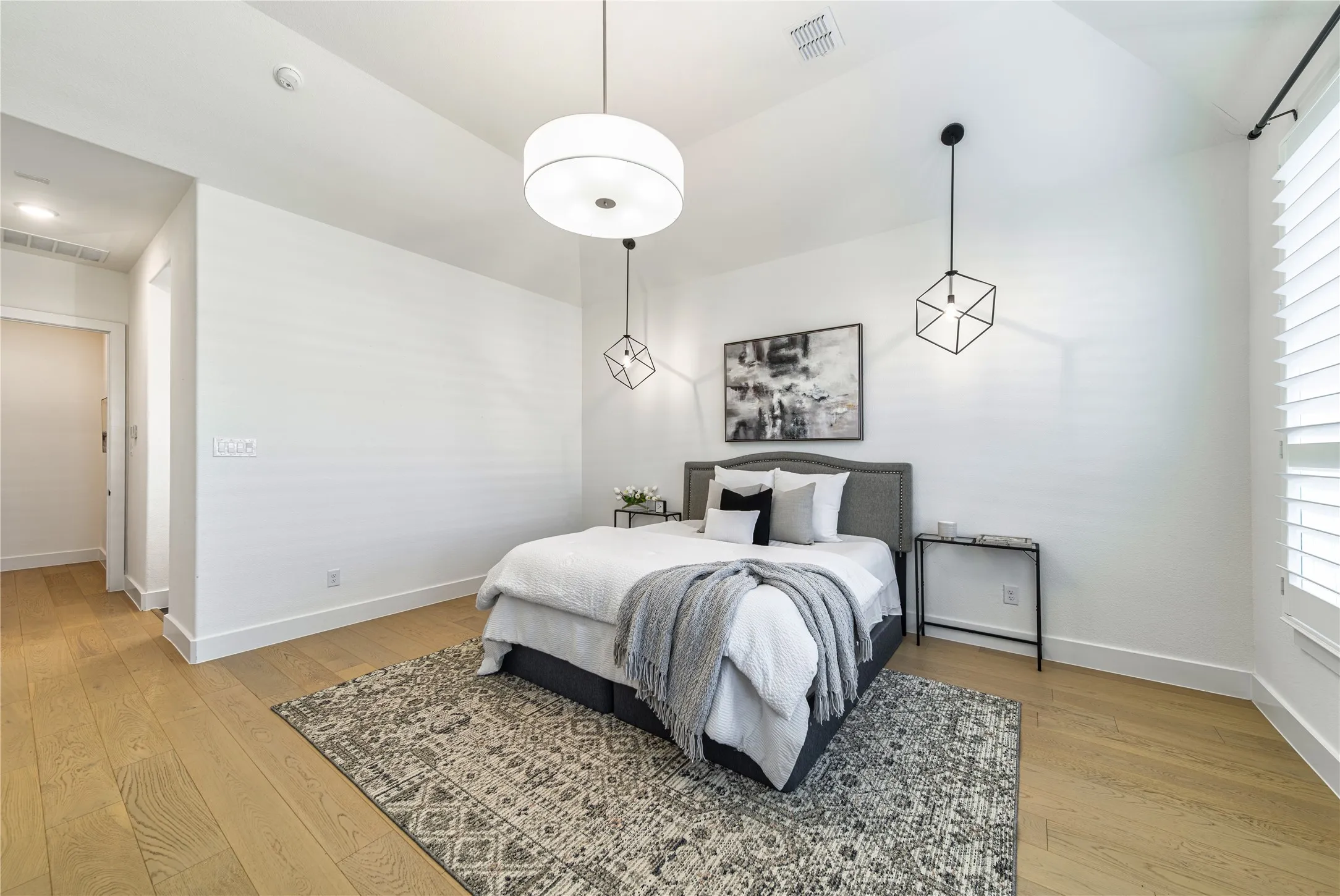 A spacious primary suite designed for relaxation with generous proportions and sophisticated finishes.