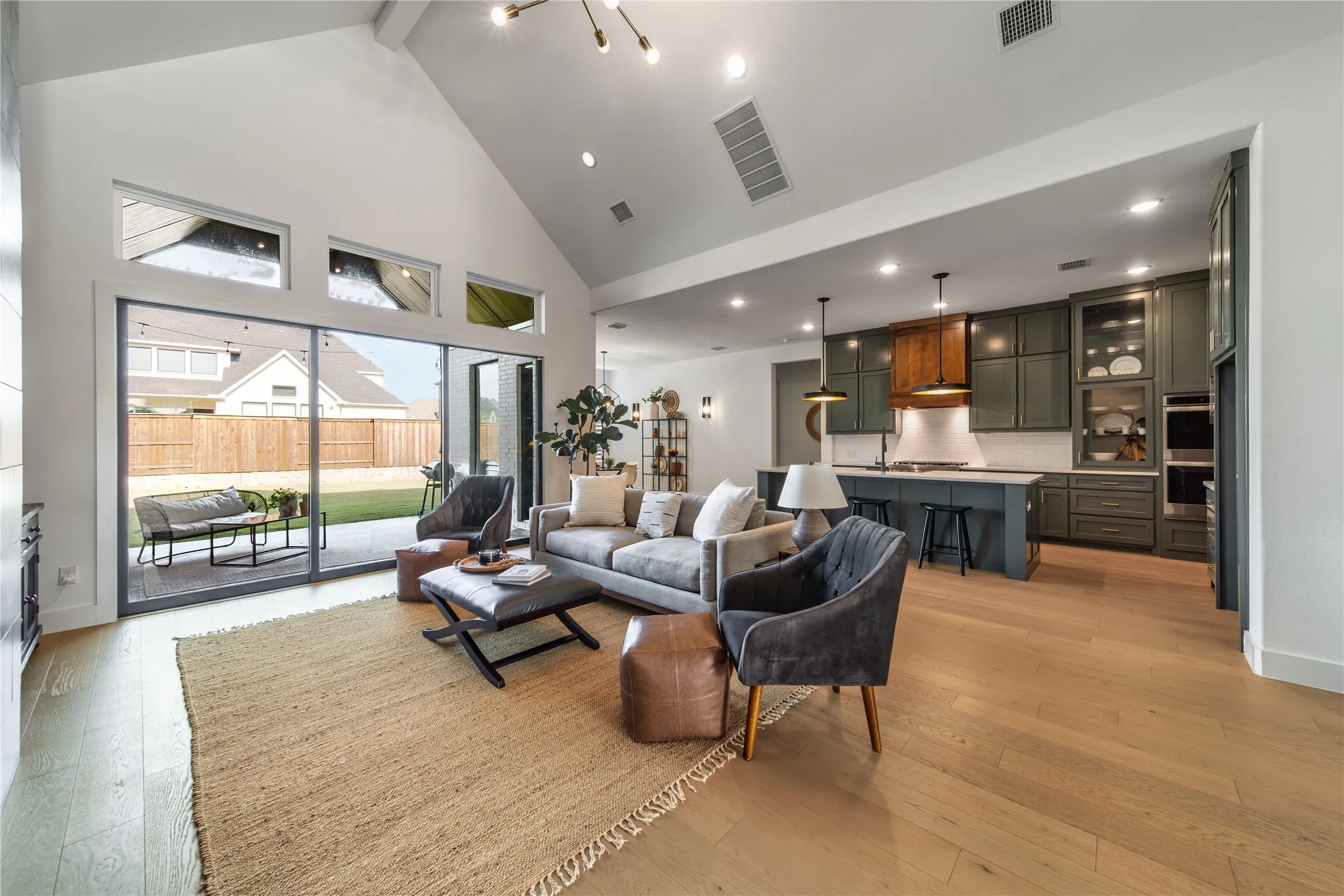 A custom fireplace, beam ceiling and open sightlines make this the true heart of the home.