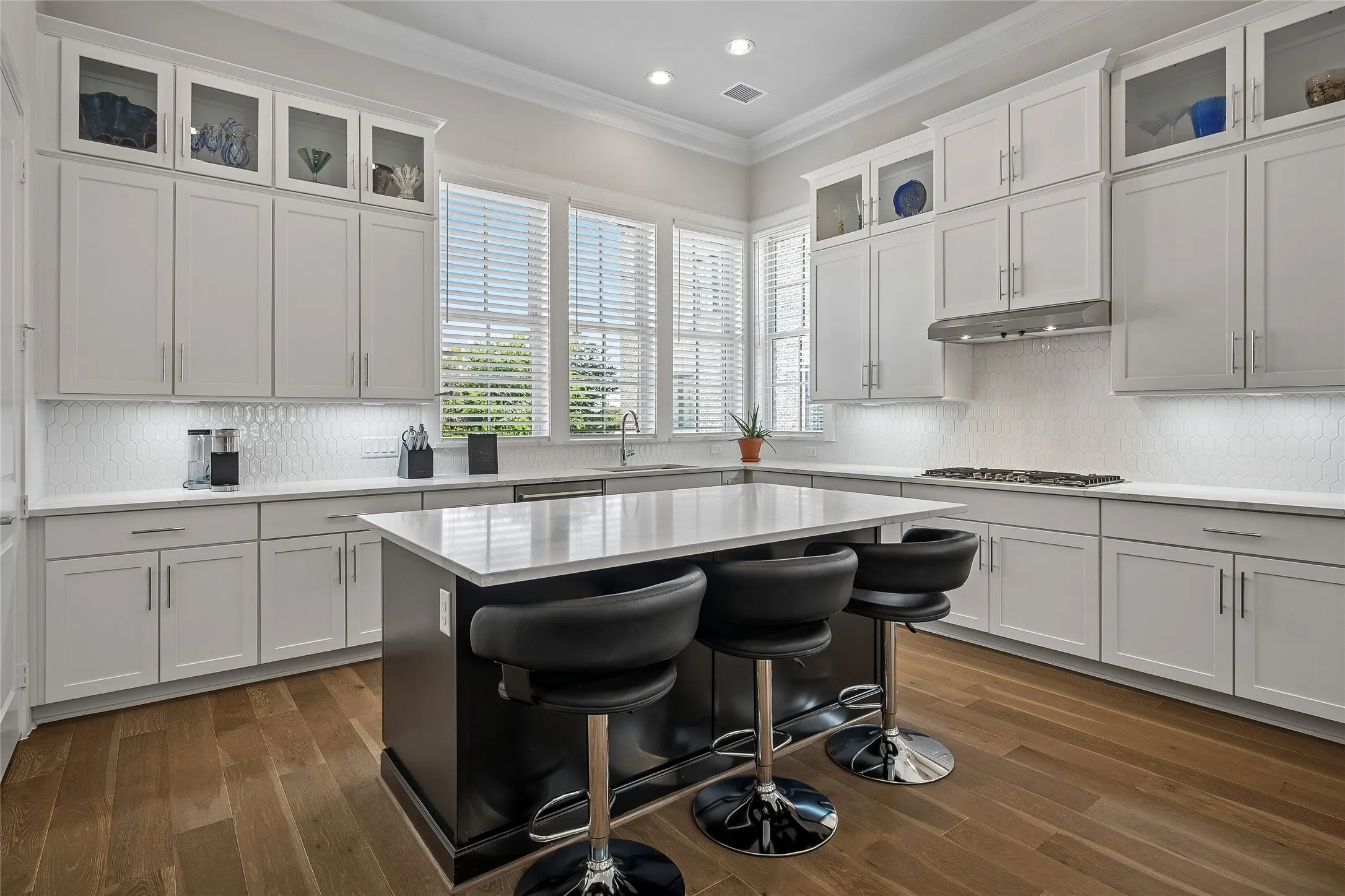 Nice Island Kitchen with Cabinets to the ceiling
