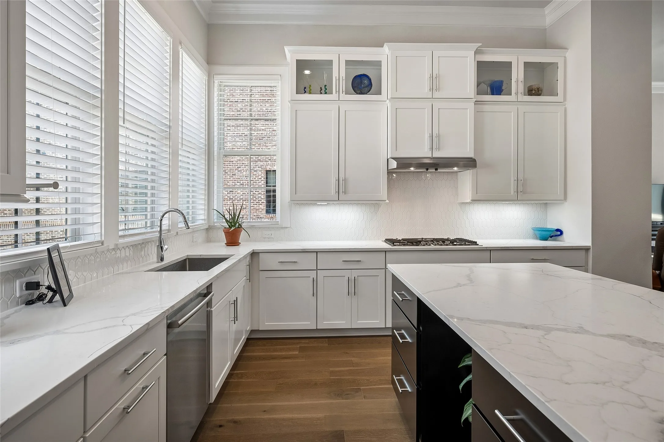Gas Cooktop, Glass in Upper Cabinet, Wine Fridge space in Island, Under Cabinet Lightin