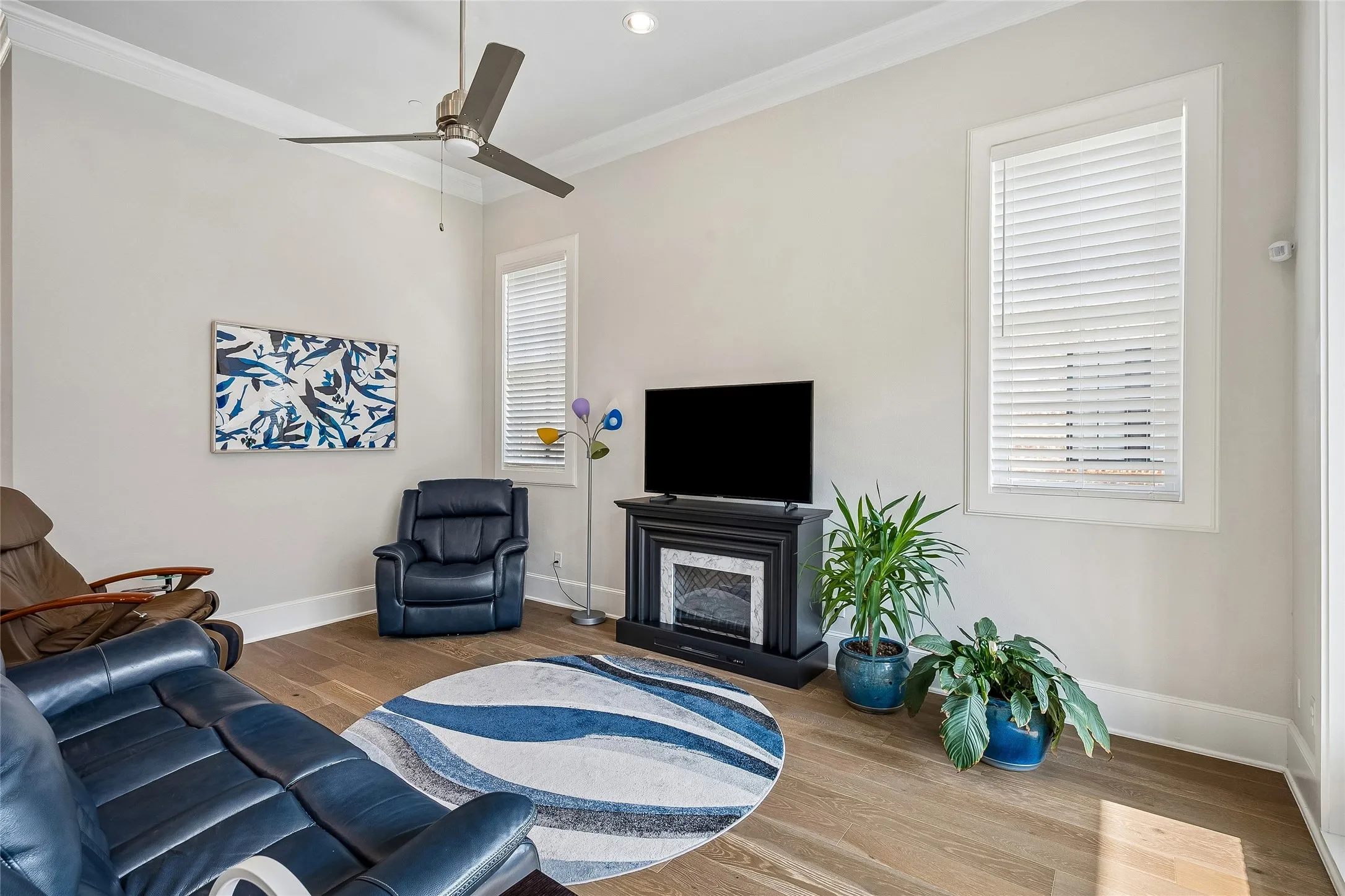 Family room has great TV and Room over looks extended balcony with Glass Sliders