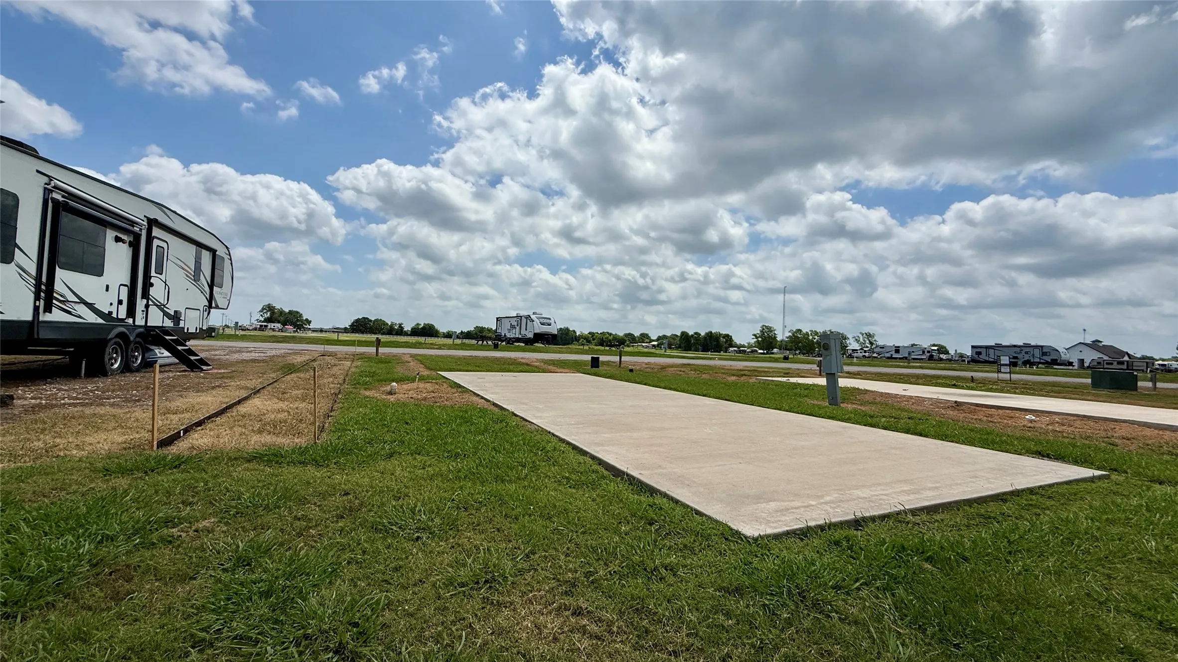 Concrete pad positioned for lakefront enjoyment.