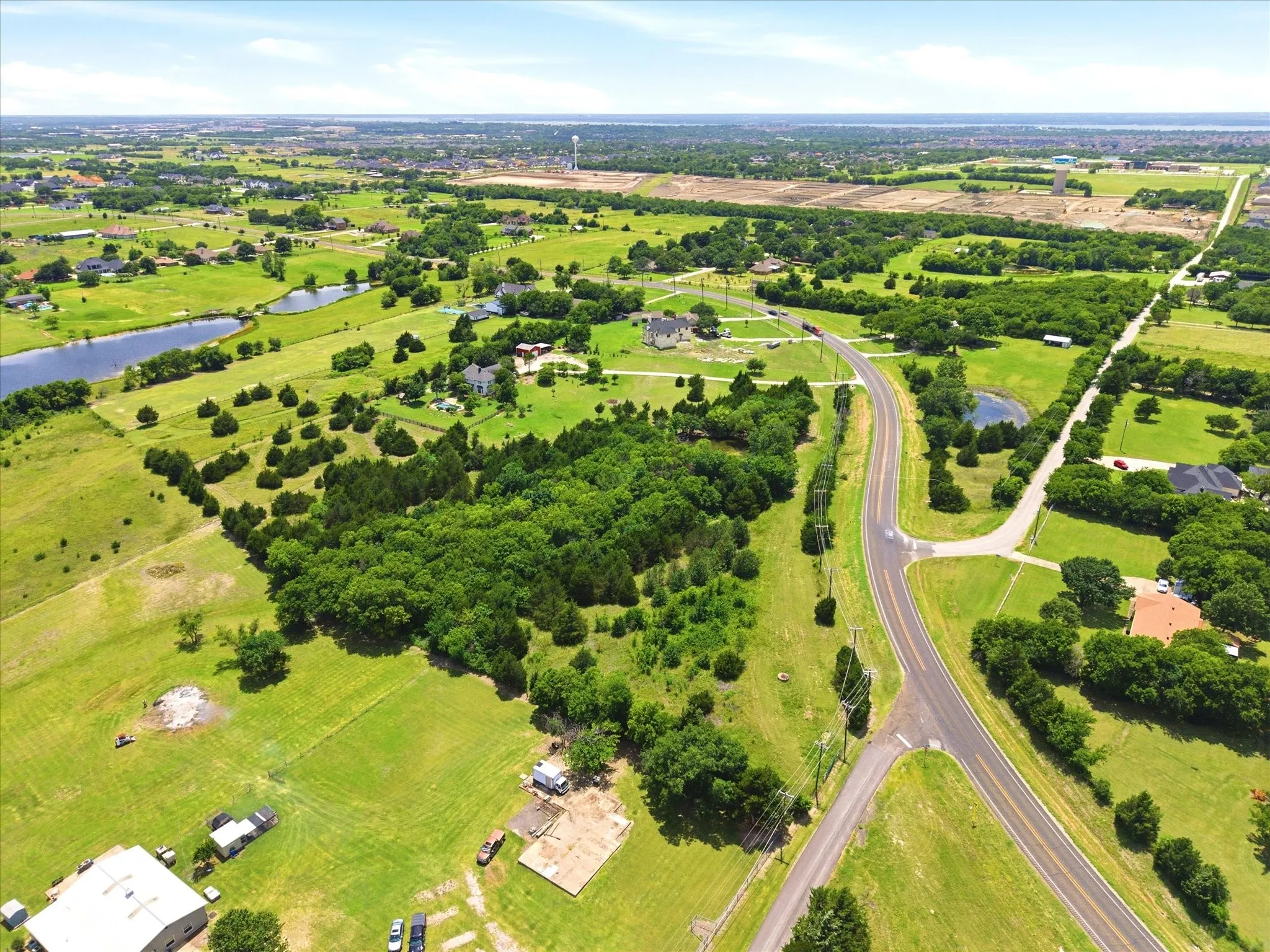 Beautiful treed acreage provides sought after privacy for your country estate!