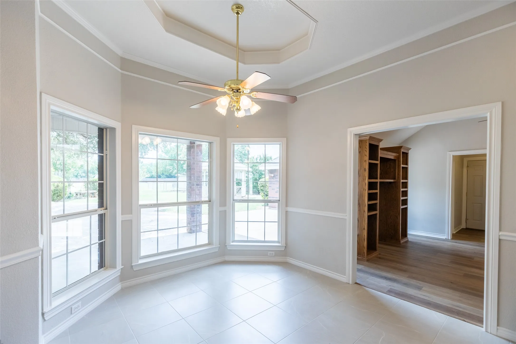 Breakfast area, and to the right 2nd living. Just past the 2nd living is the half bath to the left, and utility room to the right. Pictured is the exterior door to garage.