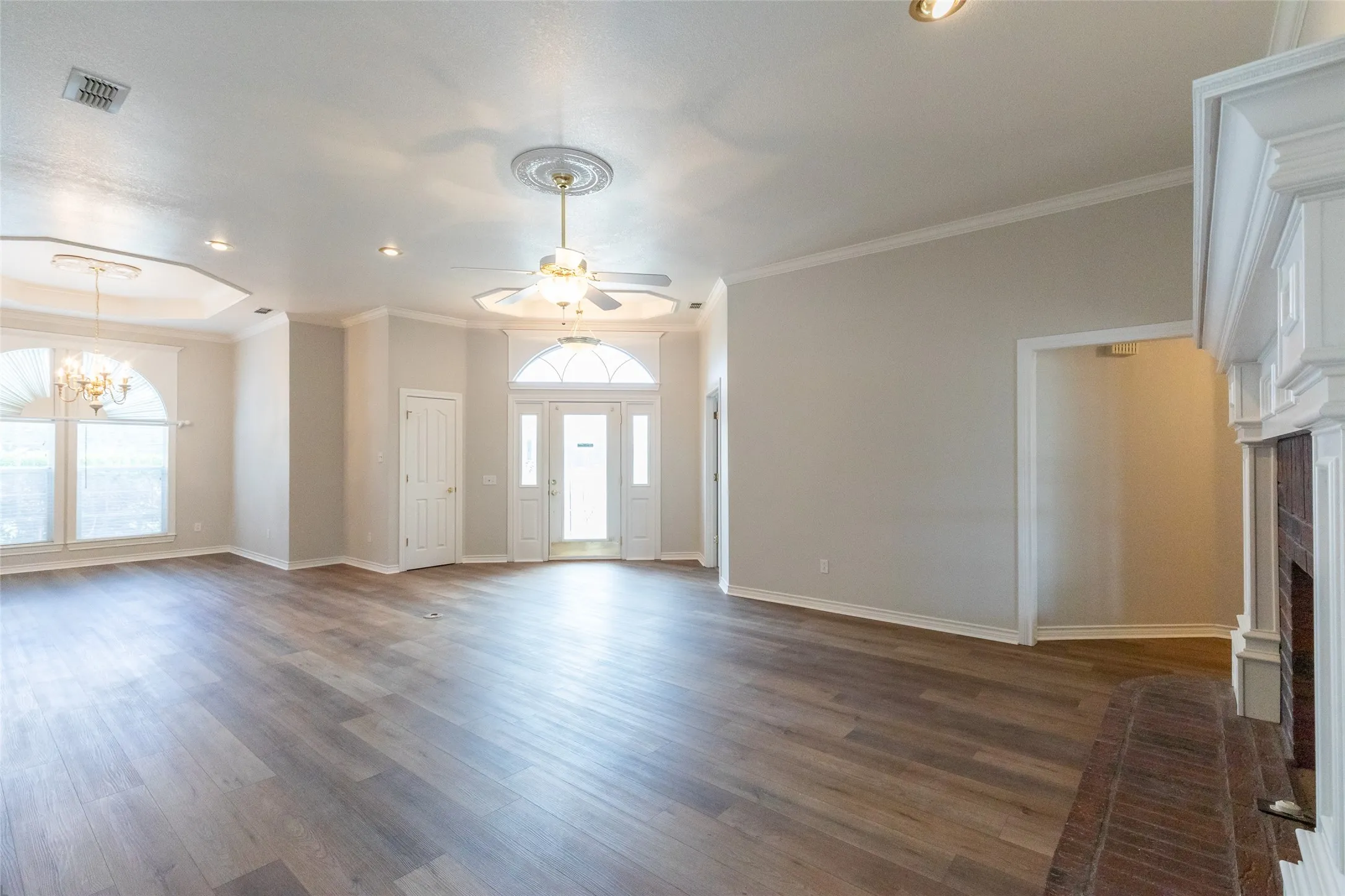 Just off the front door to right is the private office. Opening to right of full masonry fireplace is hall way to 2 additional bedrooms and baths plus 2 hall closets.