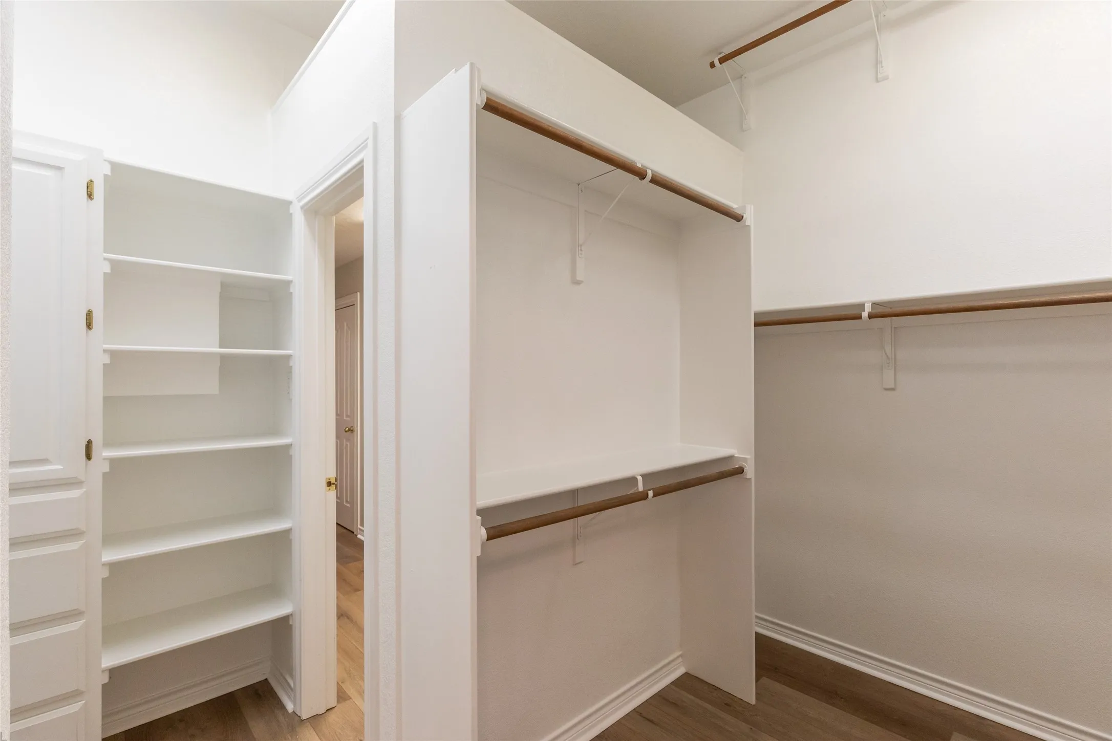 Another view of the master closet. Notice the off season, high rod. The master closet leads to the laundry room with sink and utility closet.