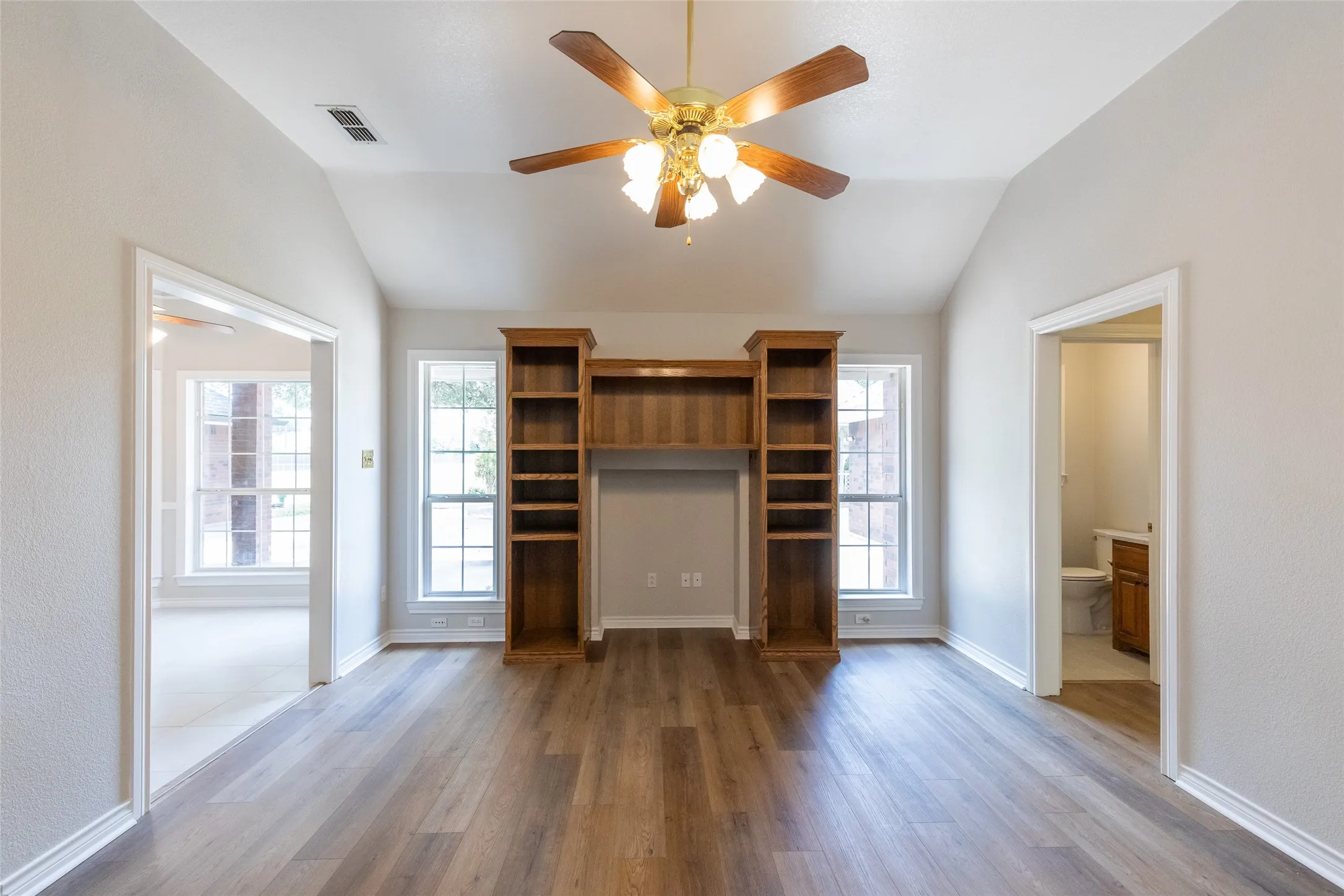 The 2nd living room has oak built ins and was used for entertainment center. Can still be used for ec or would be a great place for electric fireplace.