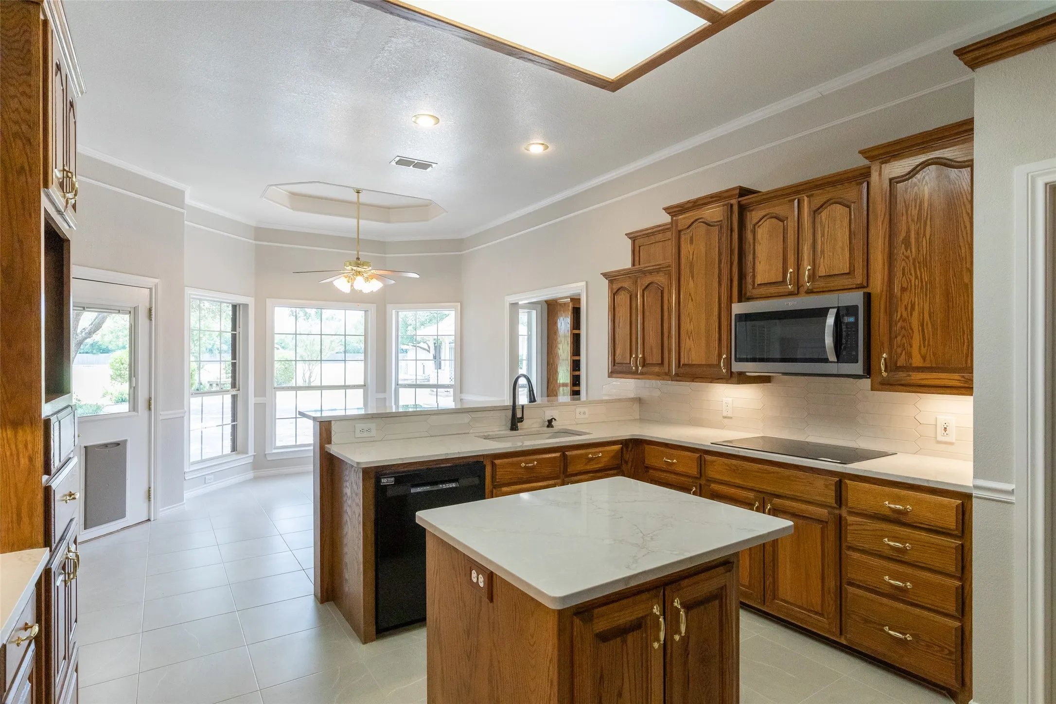 Open to the bay windowed breakfast area and back door. The room to the right of breakfast area is the 2nd living.