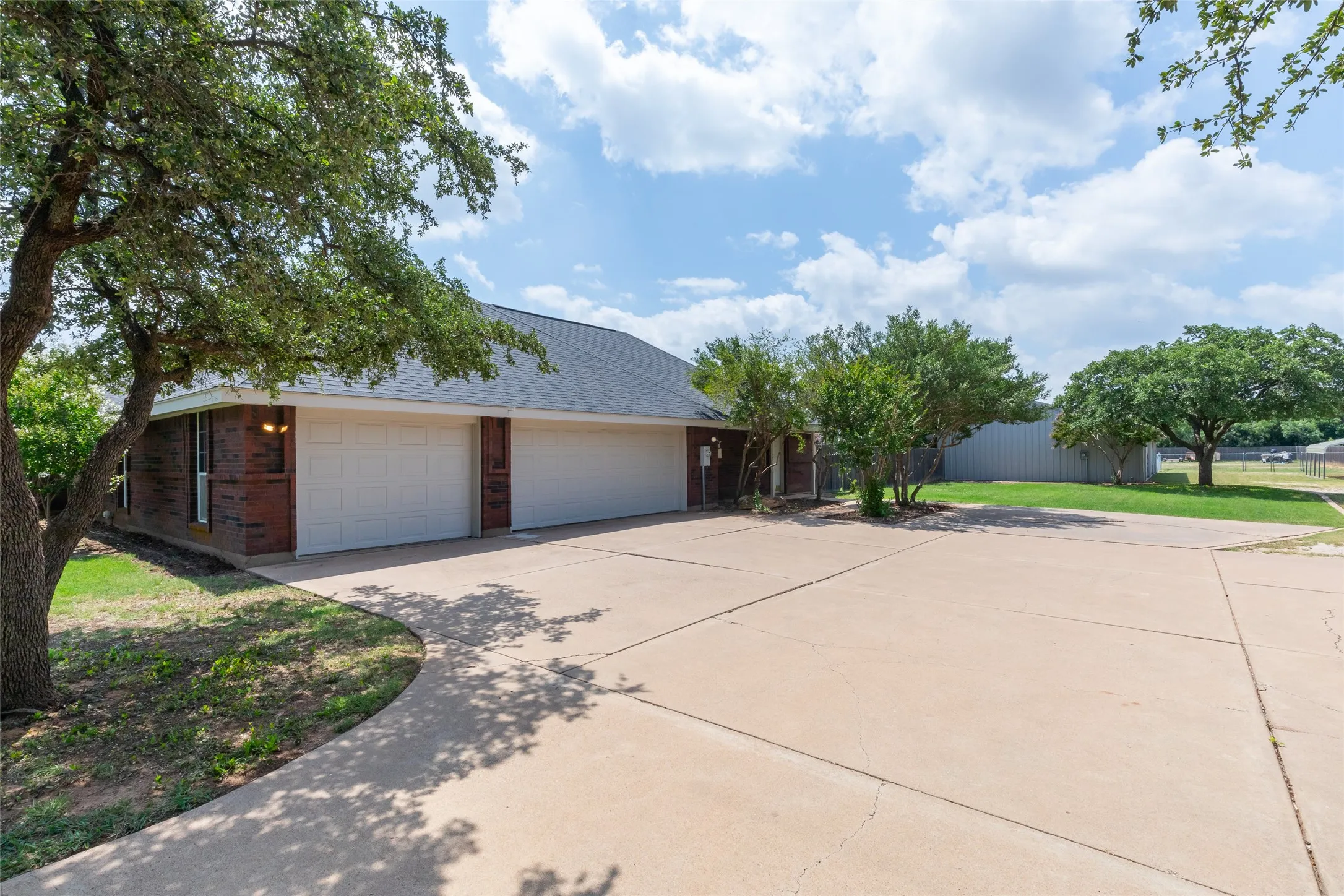 3 car garage. To the right is entrance to guest quarters parking.