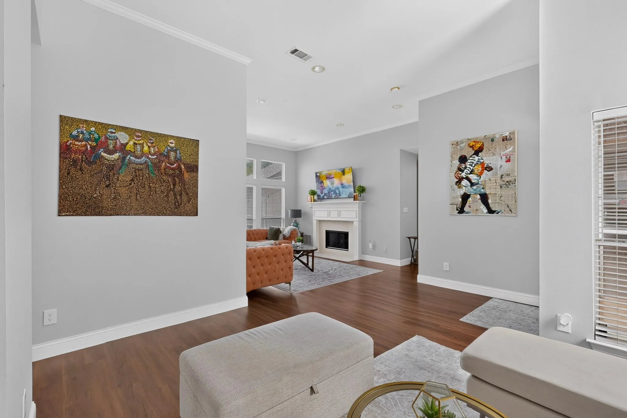 Open living space featuring wood-finish flooring and light gray wall tones