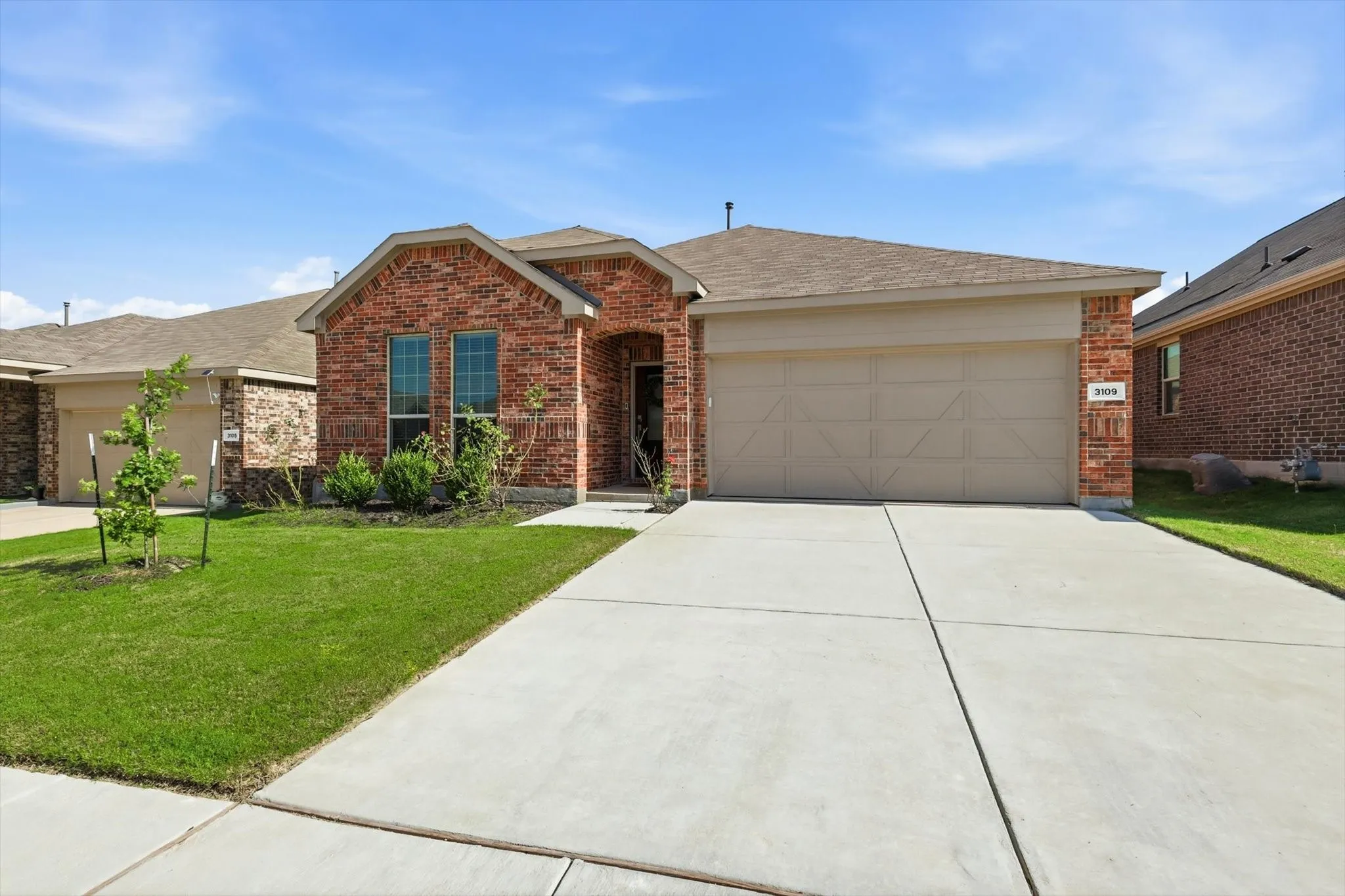 Double car garage and dual-lane driveway provide for your parking needs.