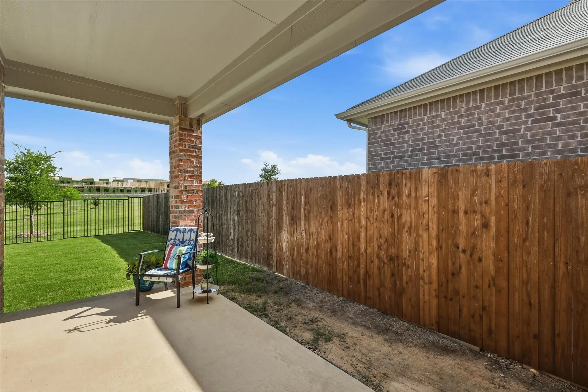 Just the right size  shaded patio for enjoying this beautiful backyard!