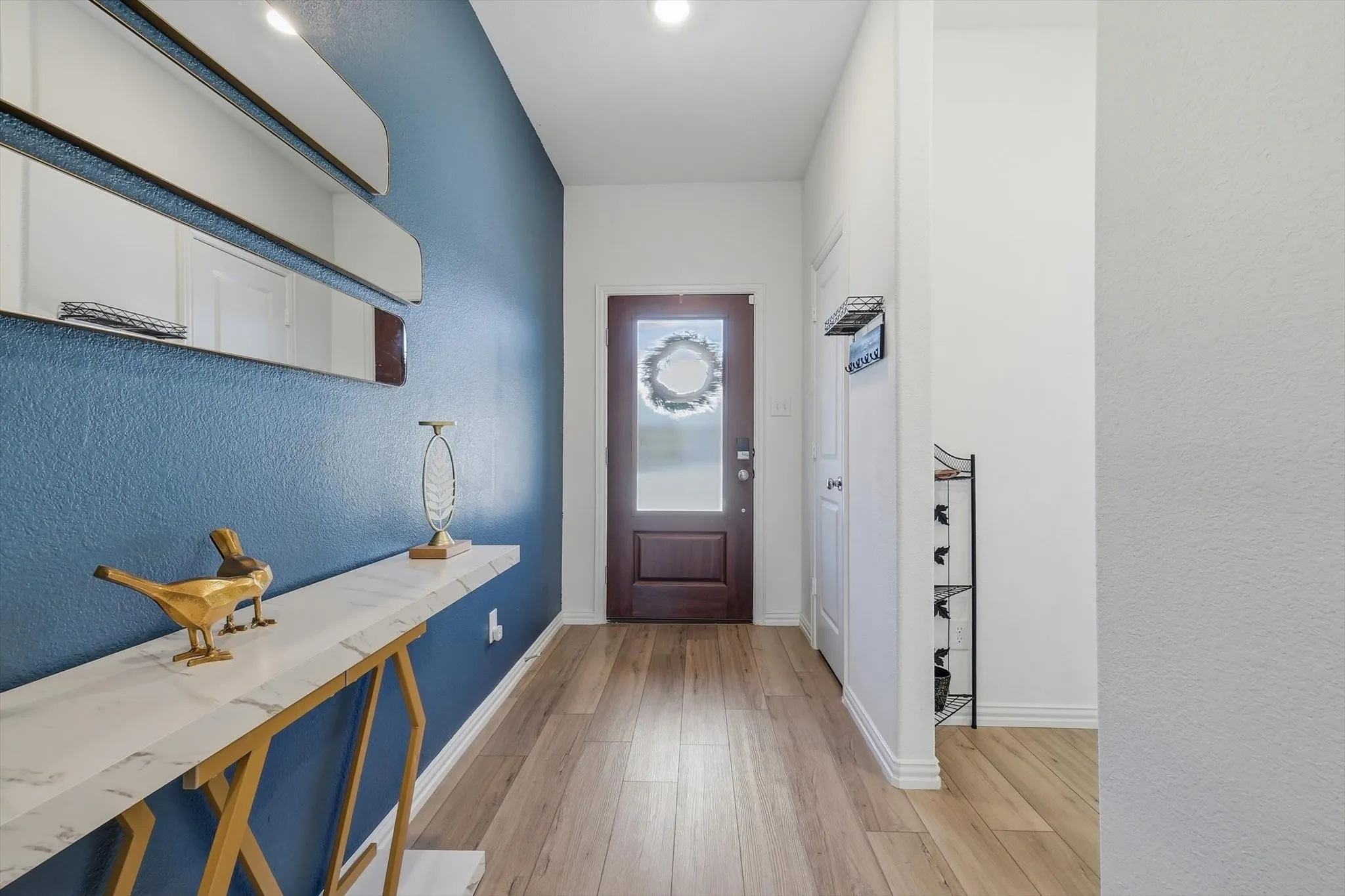 With lots of personality and style, the main entry corridor efficiently gets you from one space to another.
