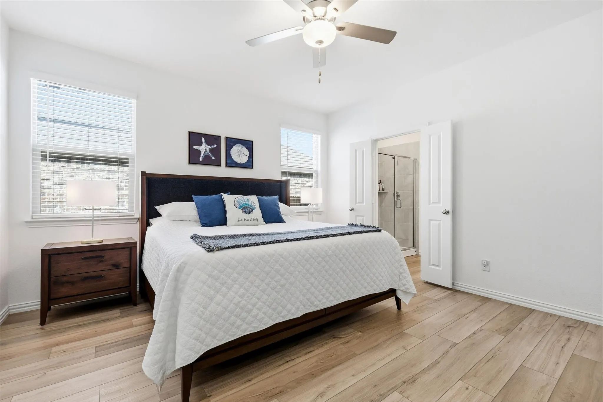 Located off the main hallway, the primary suite is split from the other bedrooms.