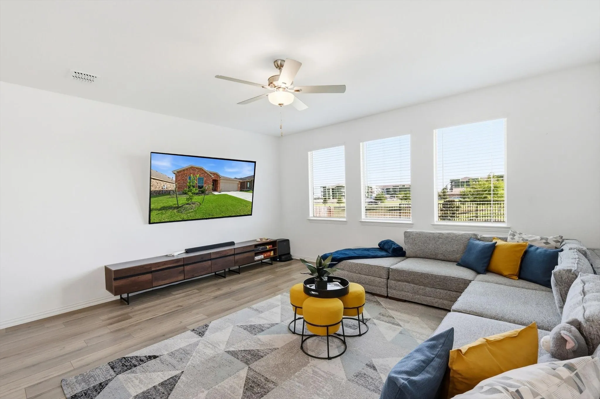 Furniture can be arranged many different ways because of the shape of the space, window placement and entry to the space.
