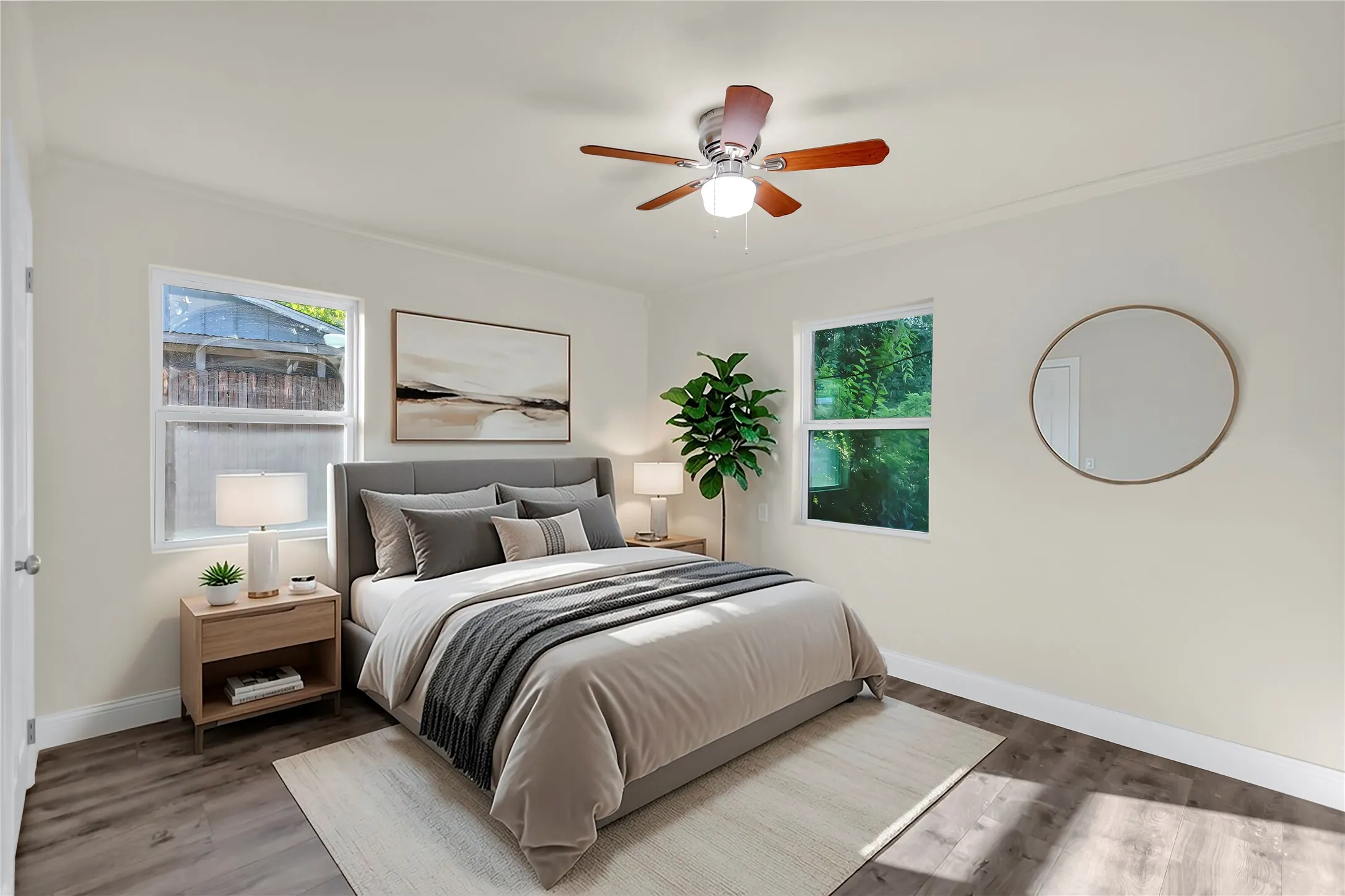 Bedroom featuring wood-finish flooring, two windows, crown molding, and a ceiling fan with integrated lighting