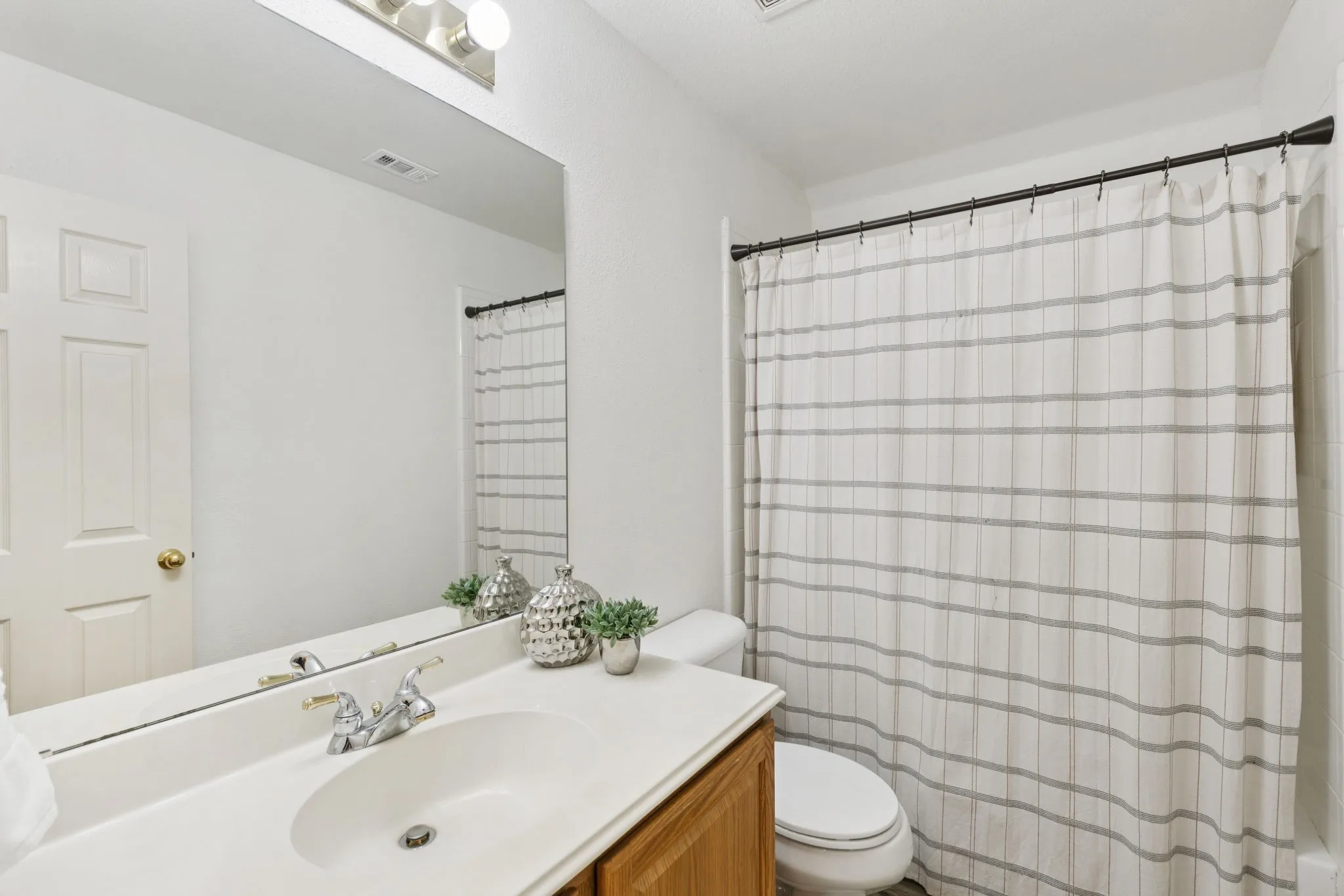 Hall bath is situated between the two secondary bedrooms and is available.