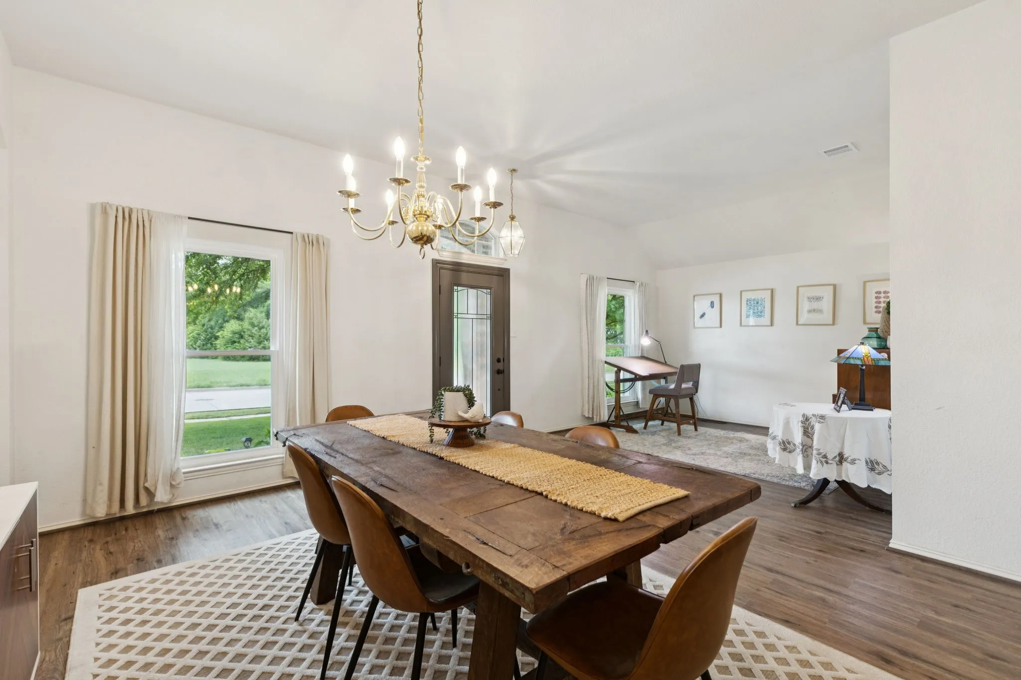 View of the dining room looking toward the striking front door.