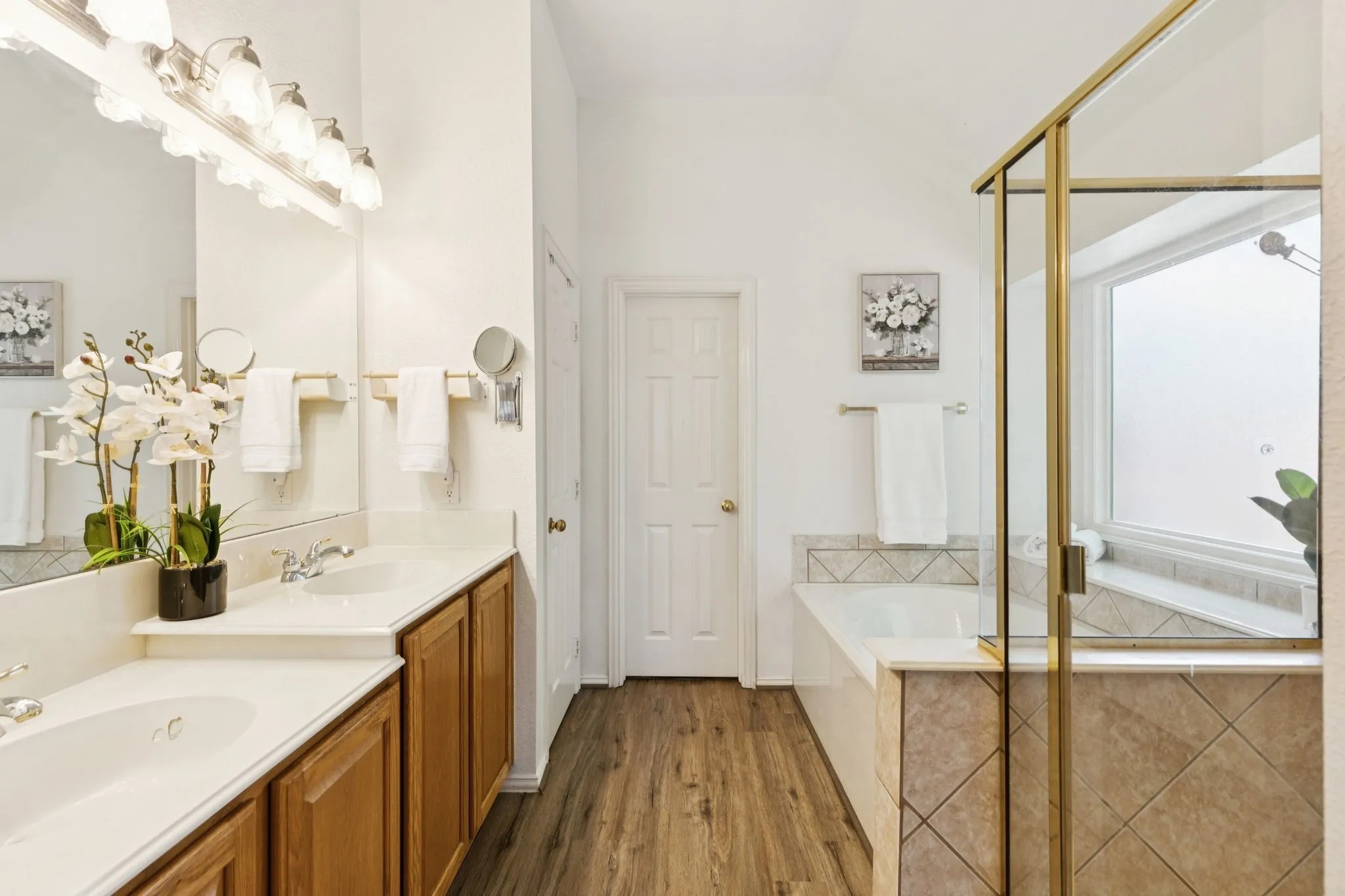Primary bathroom offers laminate flooring, garden
tub, linen closet, separate shower, separate water closet and dual vanities.