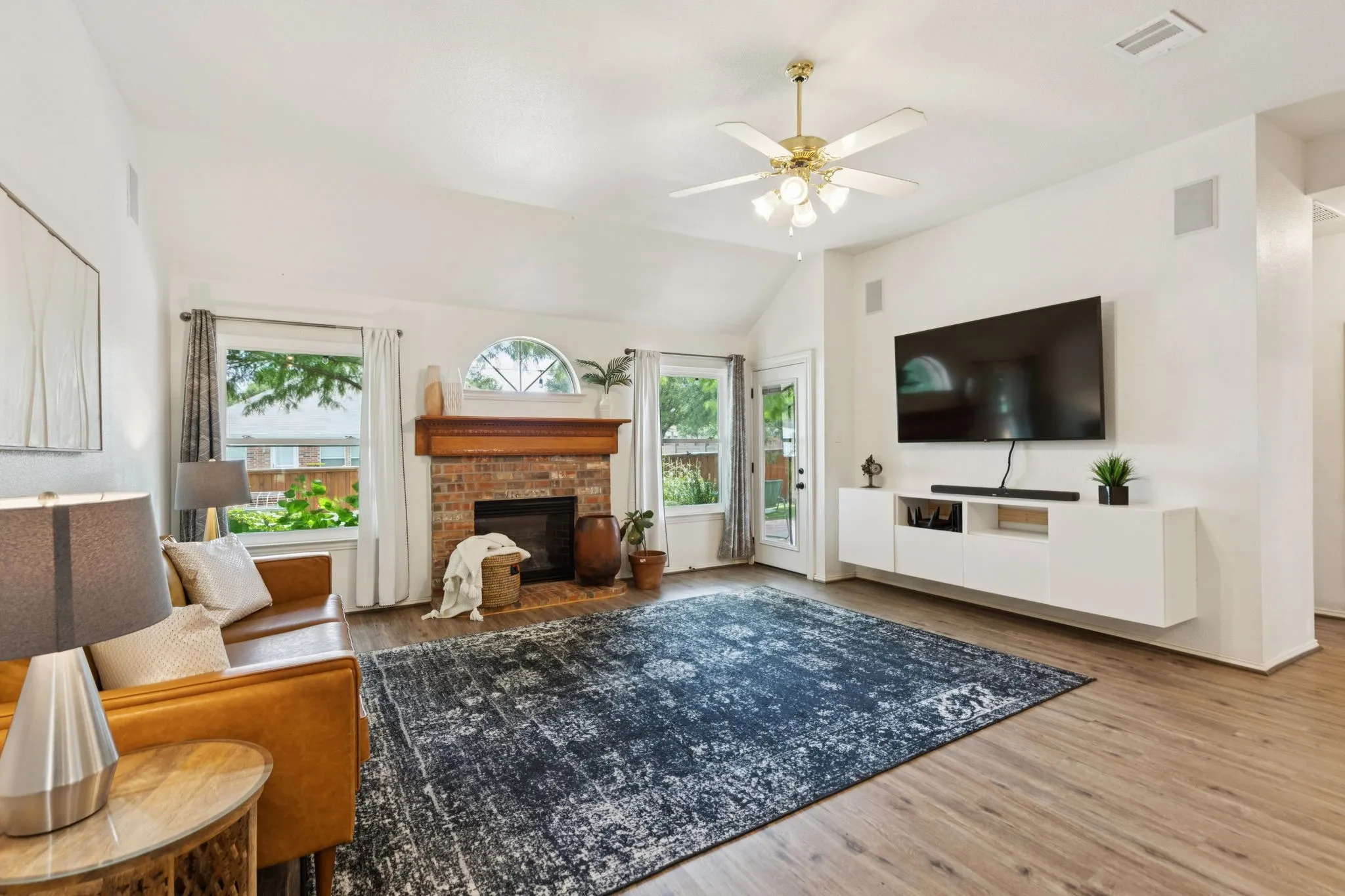 The mounted console conveys with the home. This space is wired for surround sound.