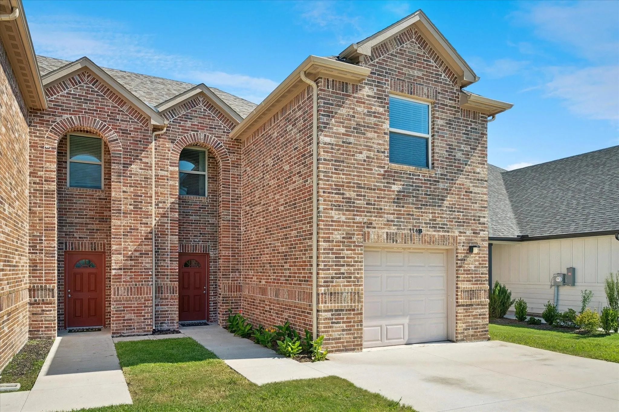 Brick facade exterior with a gabled roofline
