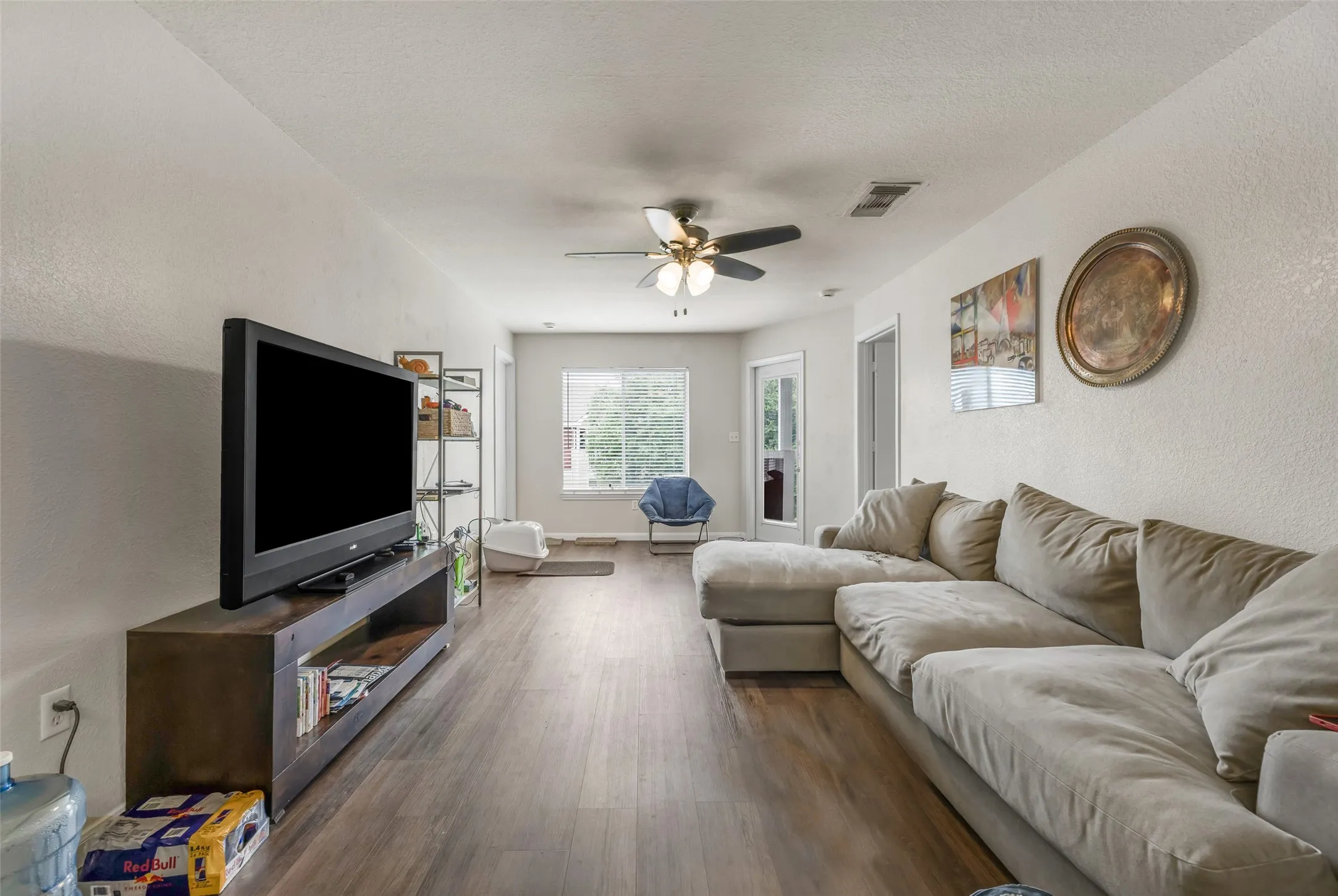 Spacious living area, the central point of condo with a bedroom in each corner.