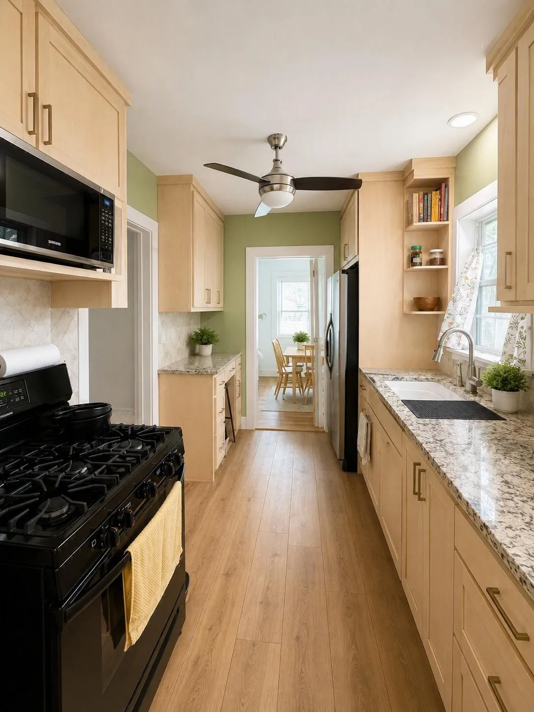 Galley kitchen featuring light wood-finish cabinetry, granite-style countertops, wood-finish flooring, a black gas range, and an undermount sink