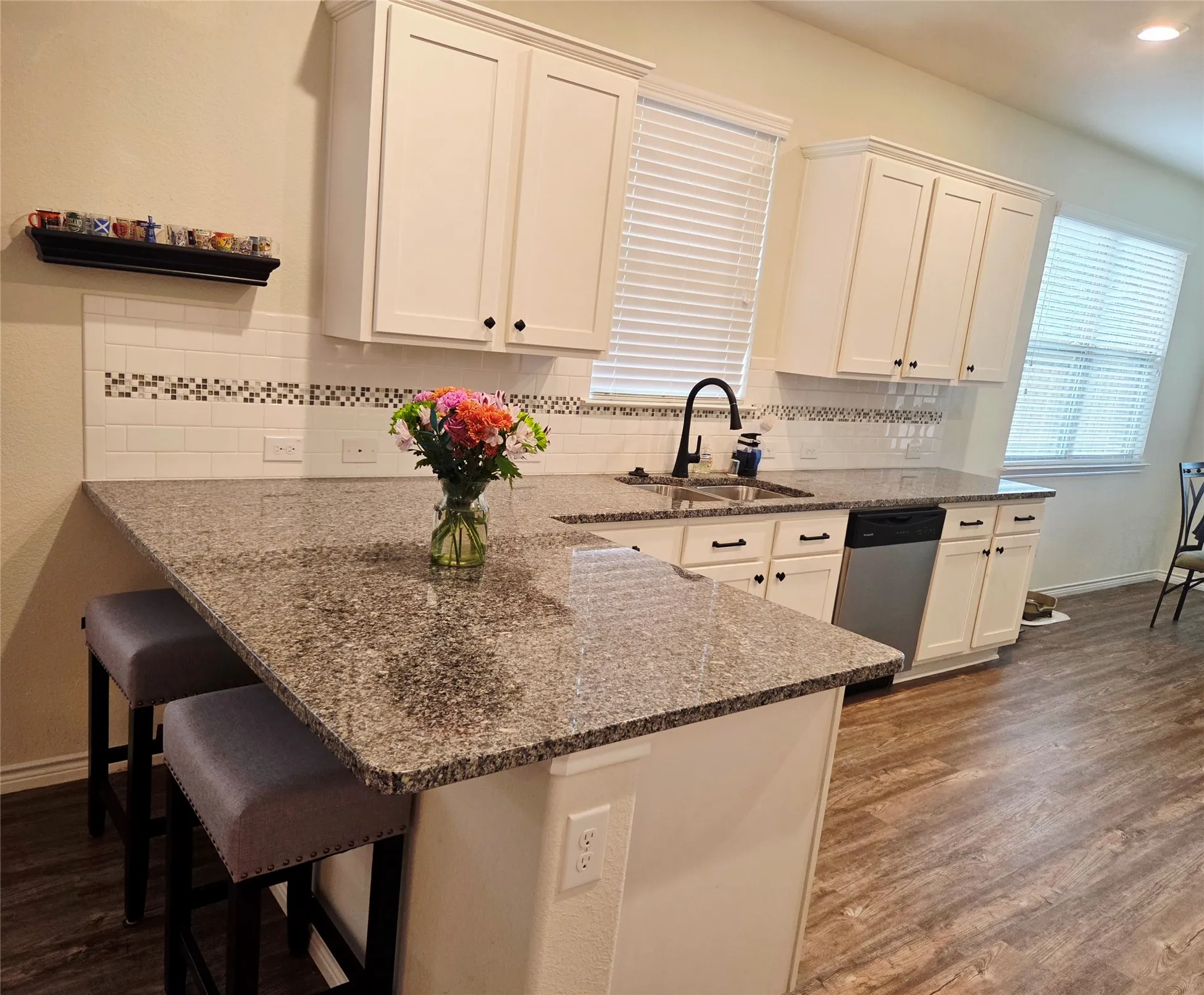 Another view of Breakfast Bar with granite countertops.