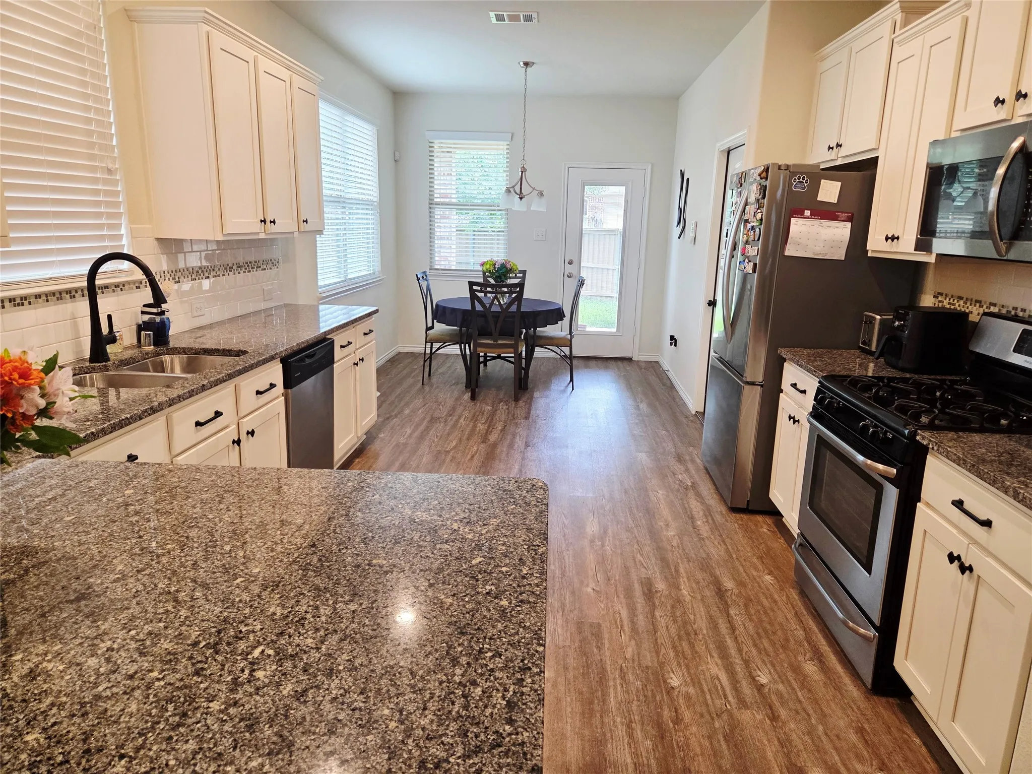 Kitchen leading off Living Room into Dining Room.