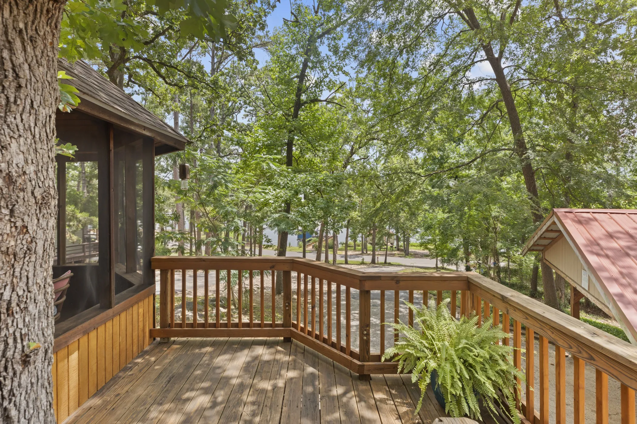 Expansive wood-finish deck with a wood railing system