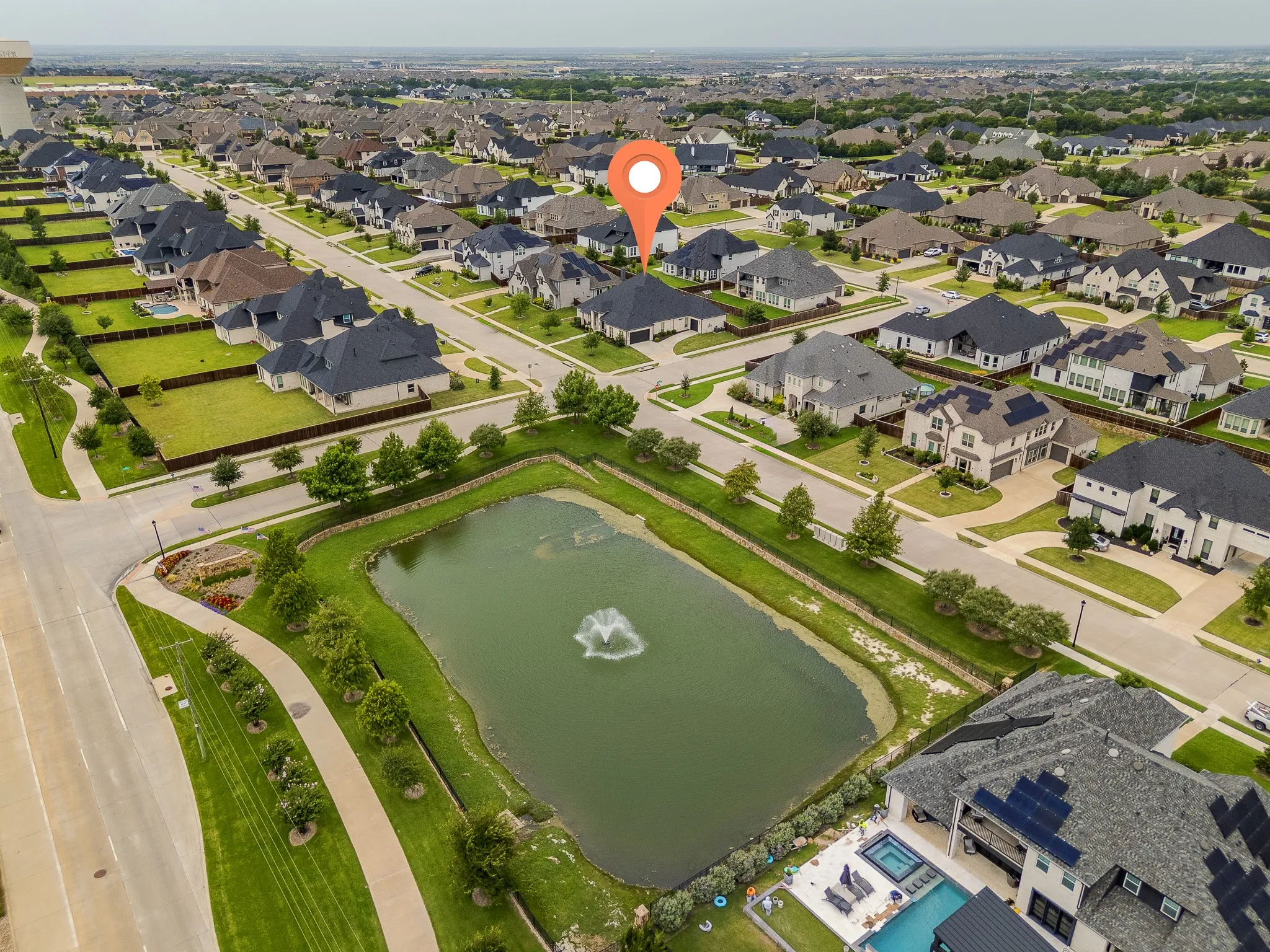 Aerial perspective of a developed residential community with numerous single-family homes