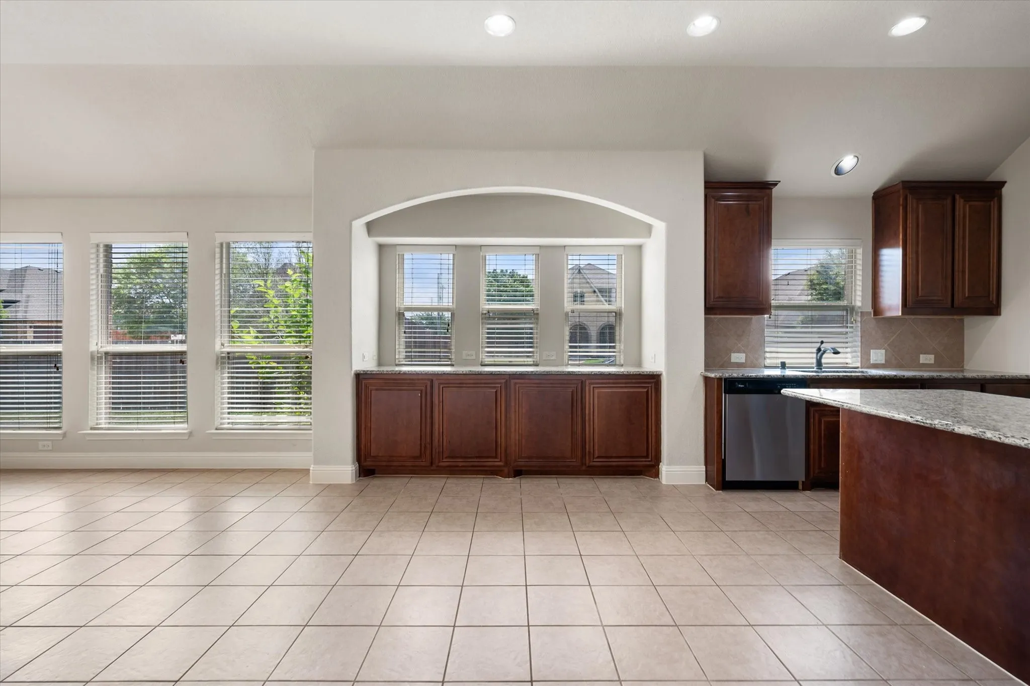Open-concept living space featuring ceramic tile flooring