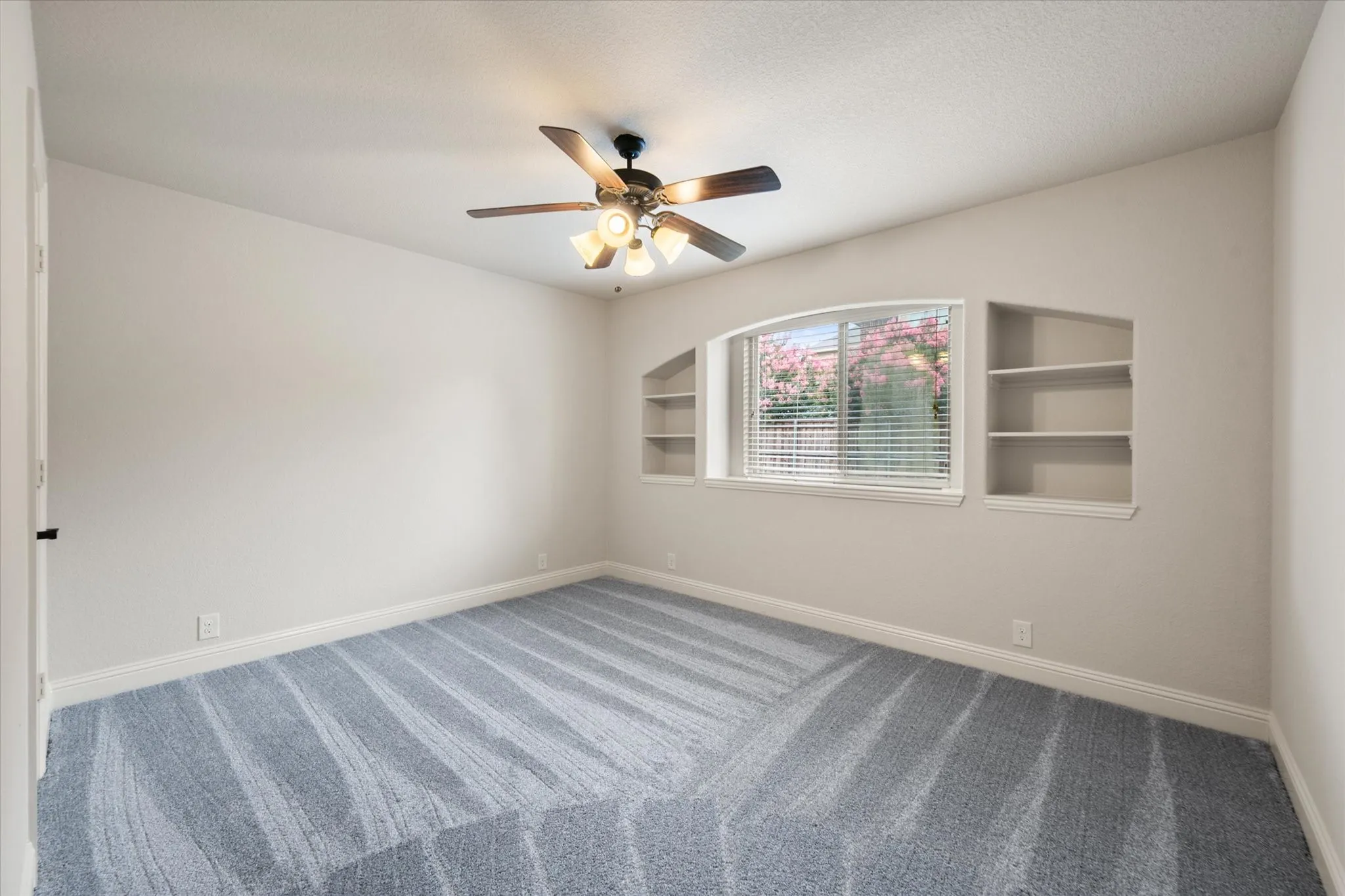 Bedroom with built in shelving