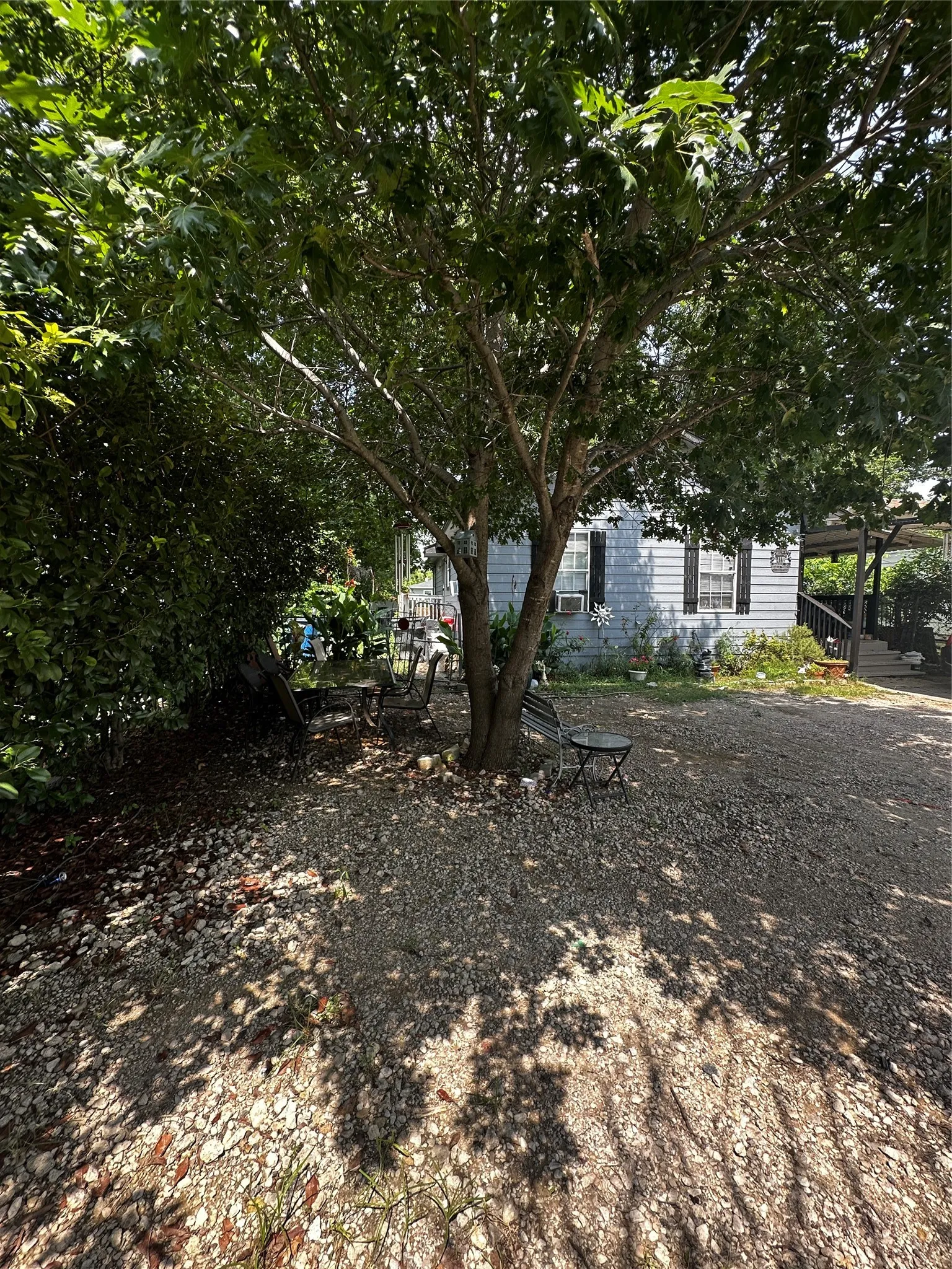 Front view with trees and parking area