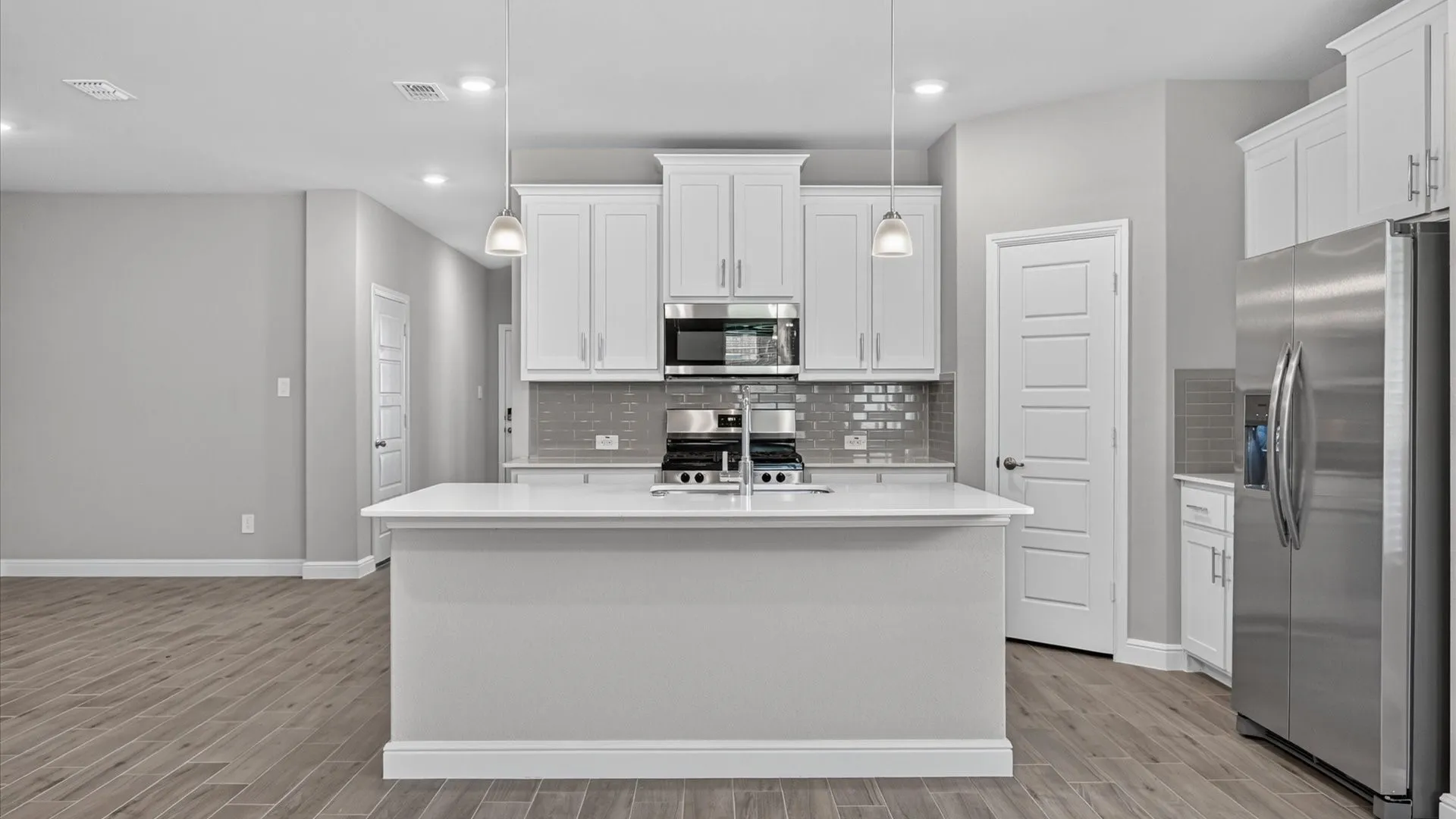 Kitchen-All Home and community information, including pricing, included features, terms, availability and amenities, are subject to change at any time without notice or obligation. All Drawings, pictures, photographs, video, square footages, floor plans, elevations, features, colors and sizes are approximate for illustration purposes only and will vary from the homes as built.